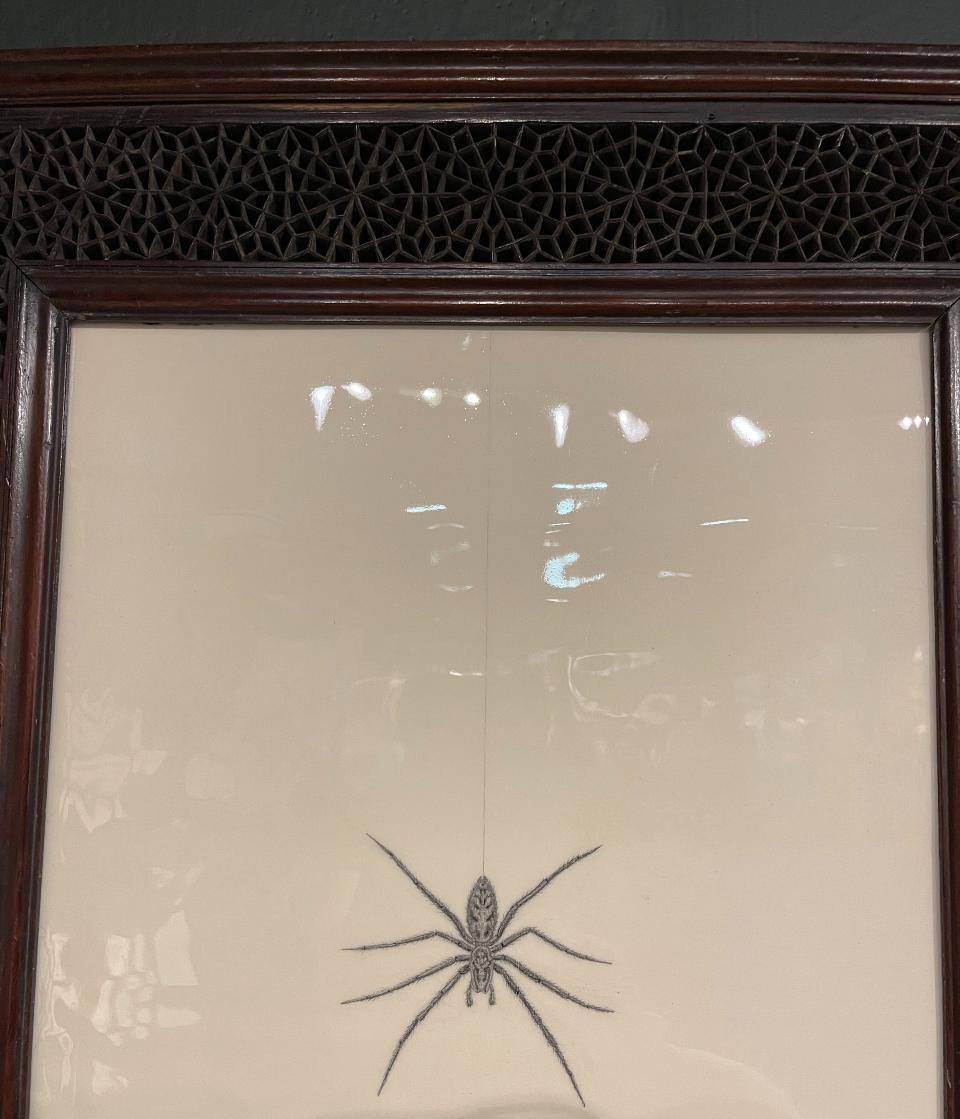 This is a unique and unusual work, by artist Tom Rooth. The spider is drawn with underglaze pencils (pencils made out of ceramic), on a handmade ceramic panel.
The handmade frame, which is Punjab, Indian, was made in circa 1880, and has a