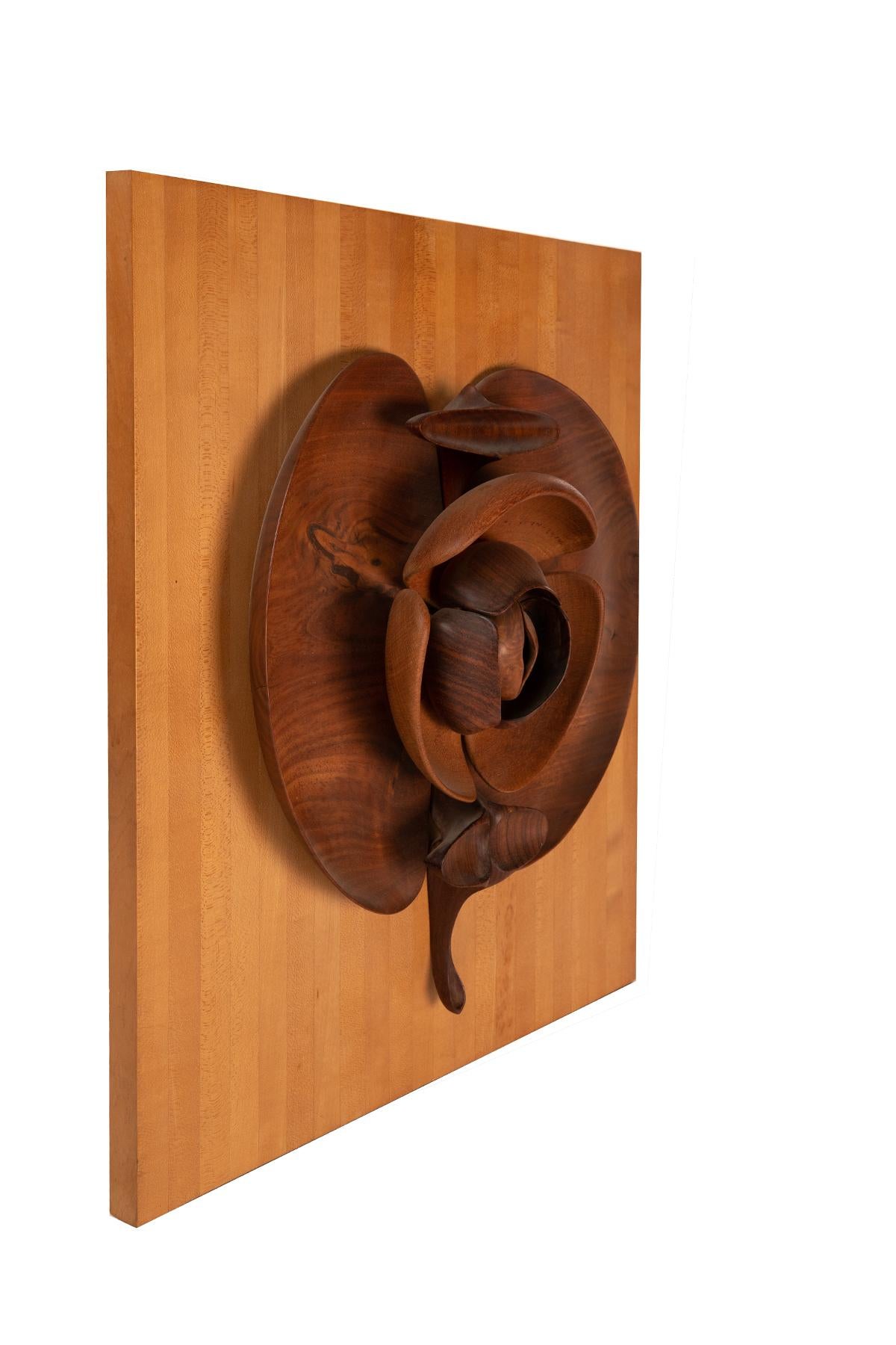 This exquisite biomorphic wall sculpture, a keen example of Californian Modern style, is by artist & designer Tom Tramel. This piece includes walnut, Australian lacewood, African Padauk and rosewood. This one-off sculpture was found hanging in