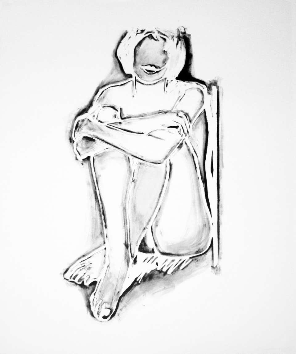 MONICA SITTING BY WALL