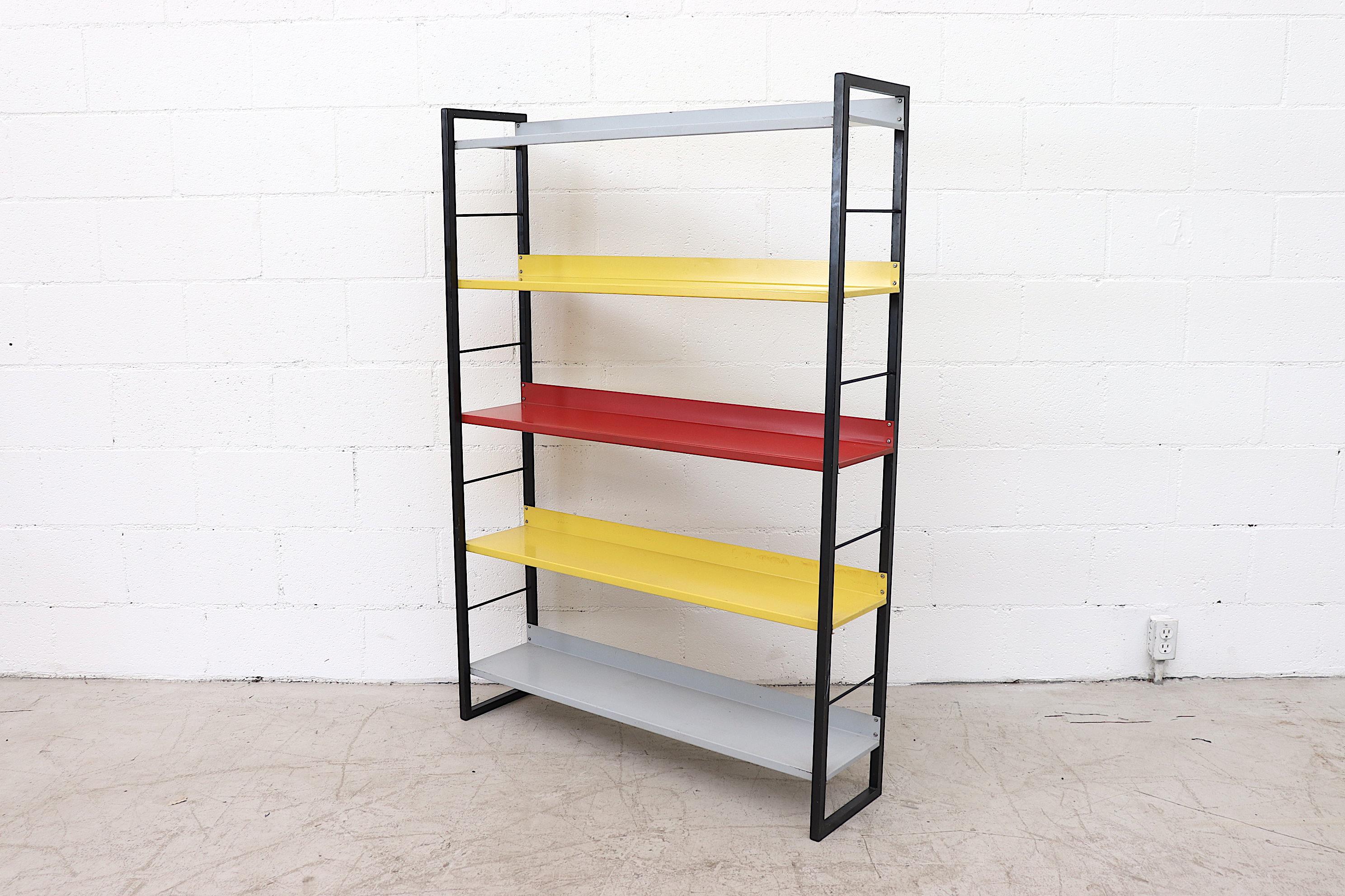 From Famed Dutch Manufacturer Tomado (An acronym for Van der TOgt Massa Artikelen DOrdrecht meaning Van Der Togt Mass Articles Dordrecht - Dordrecht being the city the company originated from) comes this enameled metal standing book shelf with