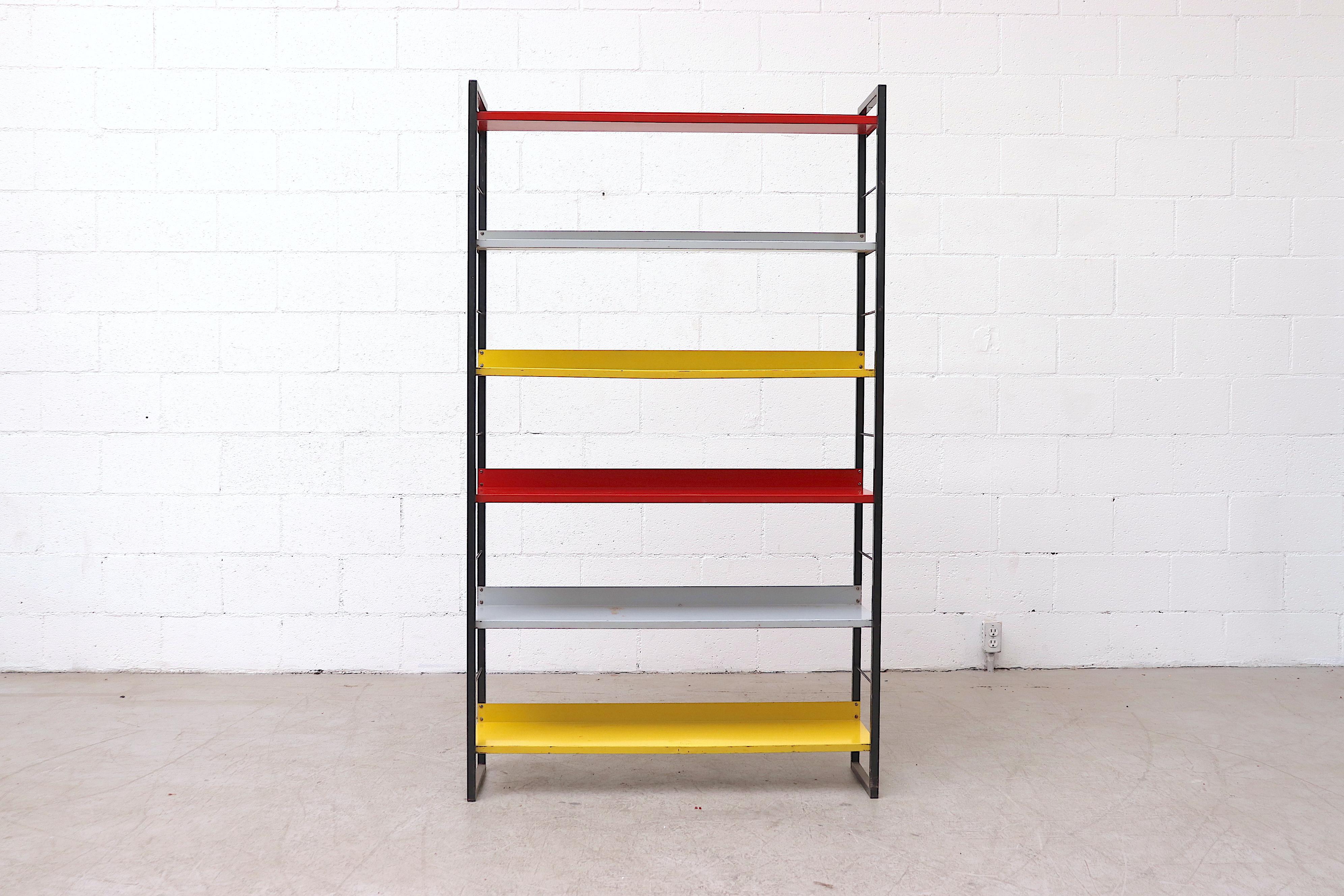 From famed Dutch Manufacturer Tomado (An acronym for Van der TOgt Massa Artikelen DOrdrecht meaning Van Der Togt Mass Articles Dordrecht - Dordrecht being the city the company originated from) comes this enameled metal standing book shelf with