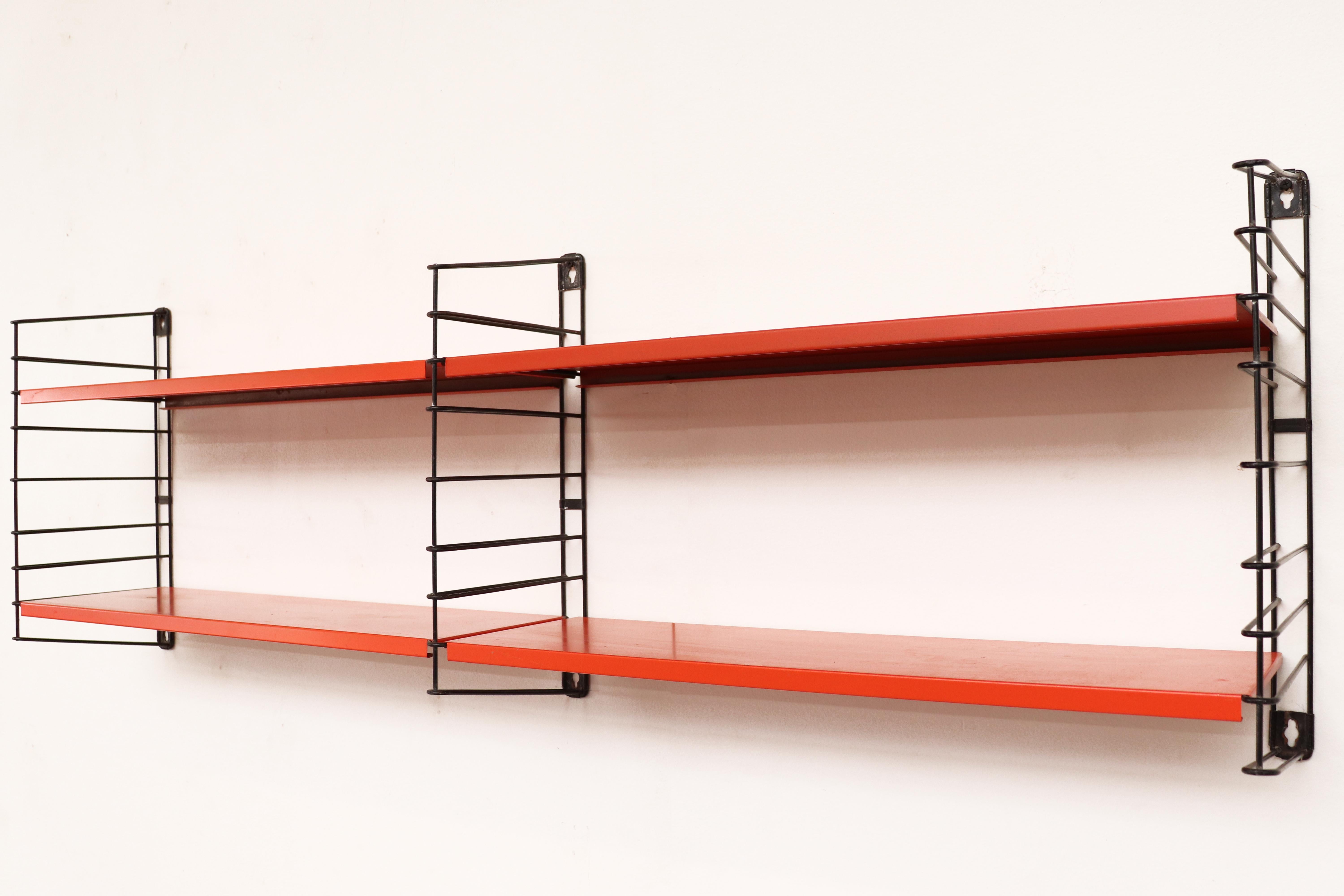 Tomado short two-section industrial shelving unit by Jan Van Der Togt. Orange enameled metal shelves and black enameled metal risers. In original condition with visible wear and some enamel loss. Shelves may vary slightly from photo. All have