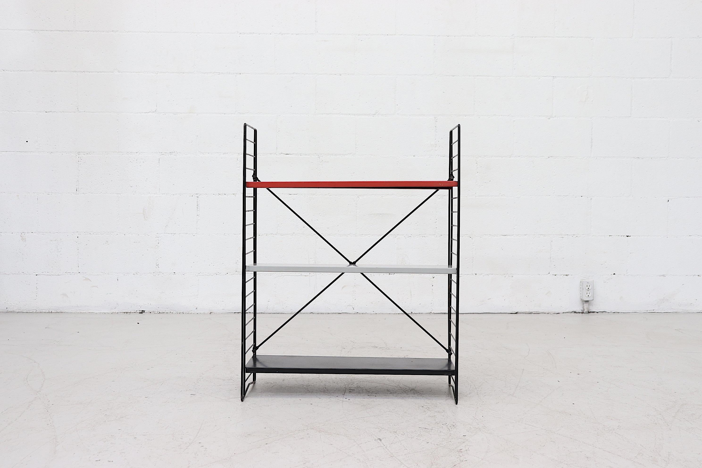 Industrial Tomado book shelf with grey, red and black metal enameled shelves on black enameled wire frame. Versatile and stylish with adjustable shelves. Shelf depth is approximate 8