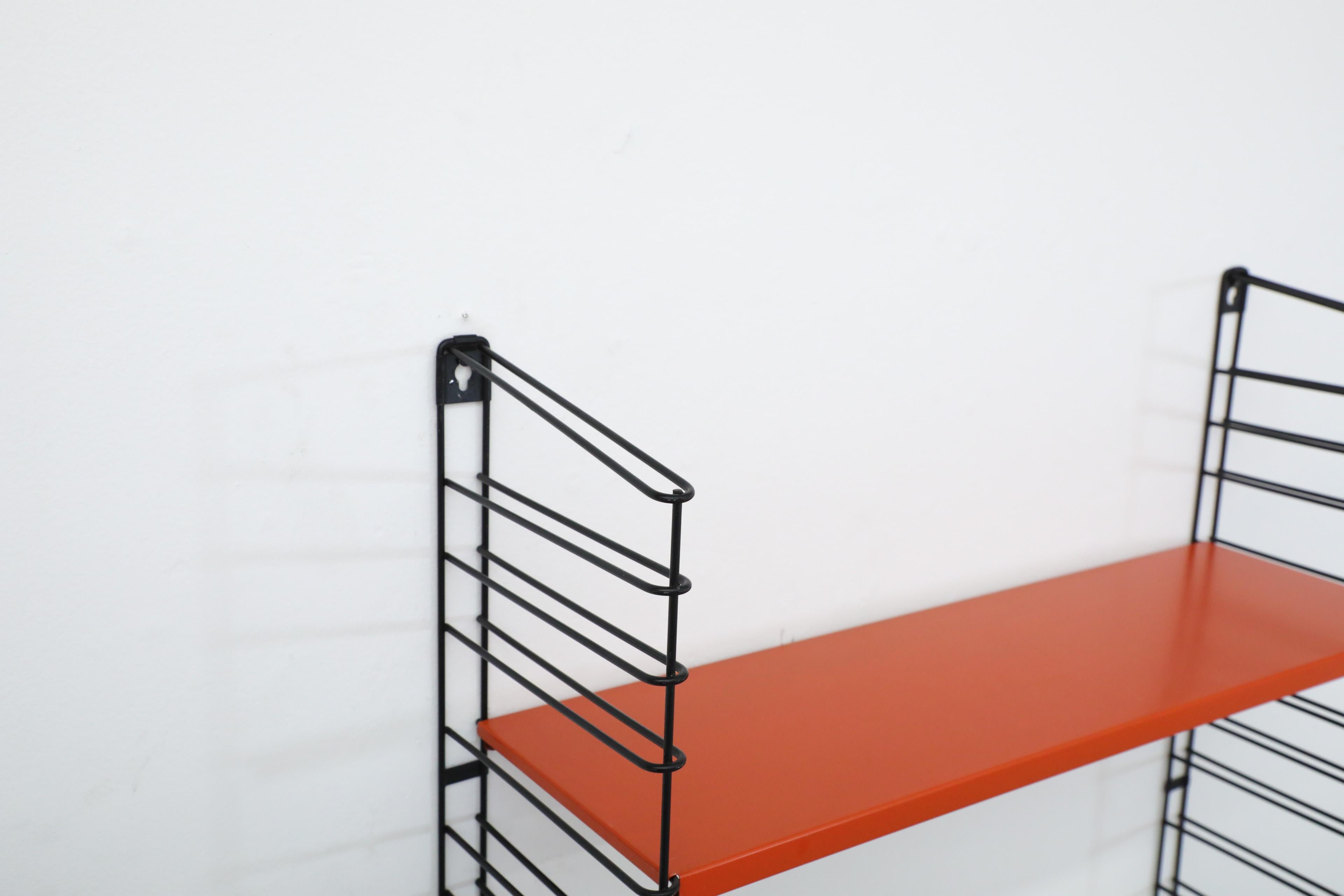 Tomado Wall Mount Black Wire Shelving Unit with Red and White Shelves In Good Condition For Sale In Los Angeles, CA