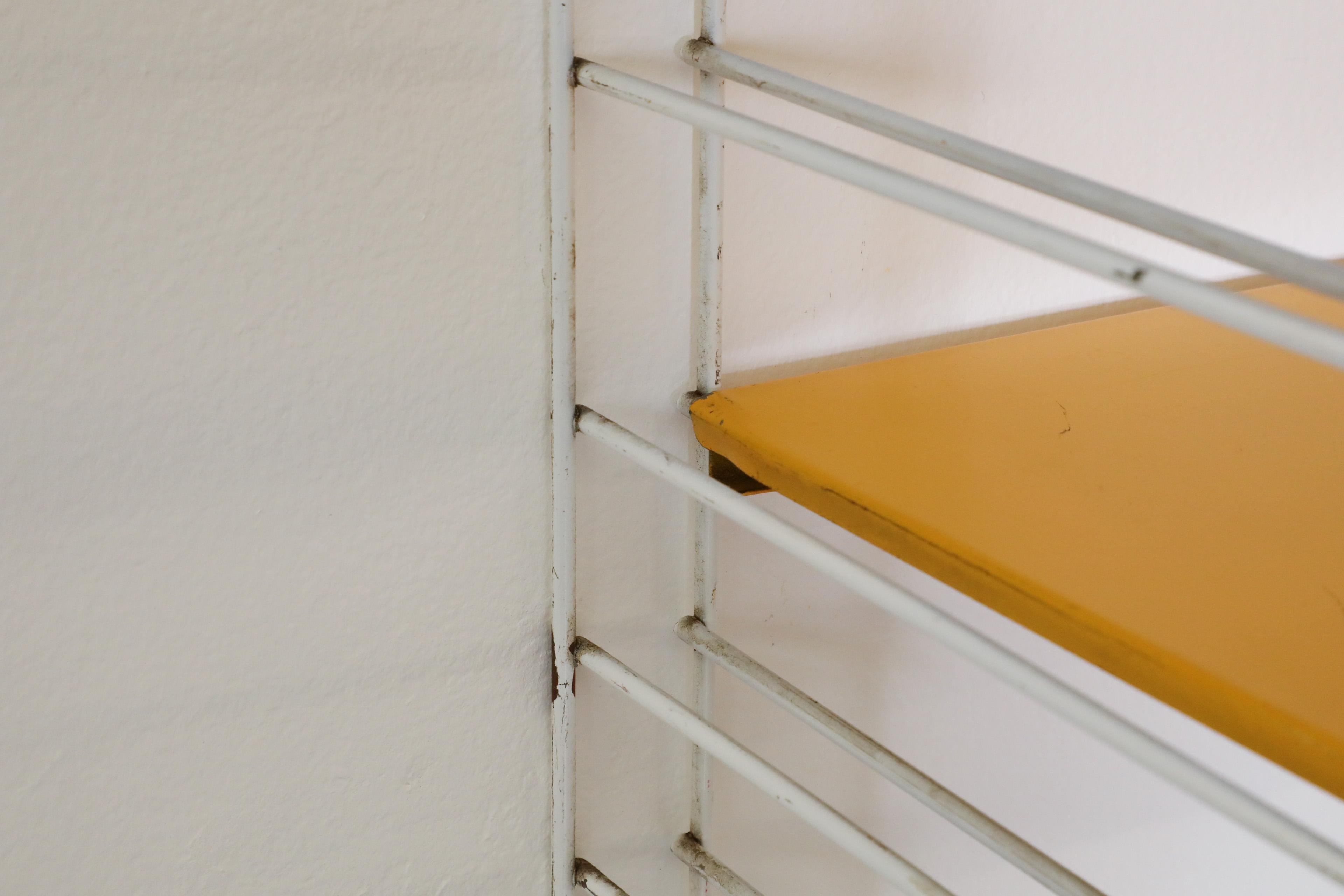 Mid-20th Century Tomado Yellow and Orange Wall Mount Shelving Unit For Sale