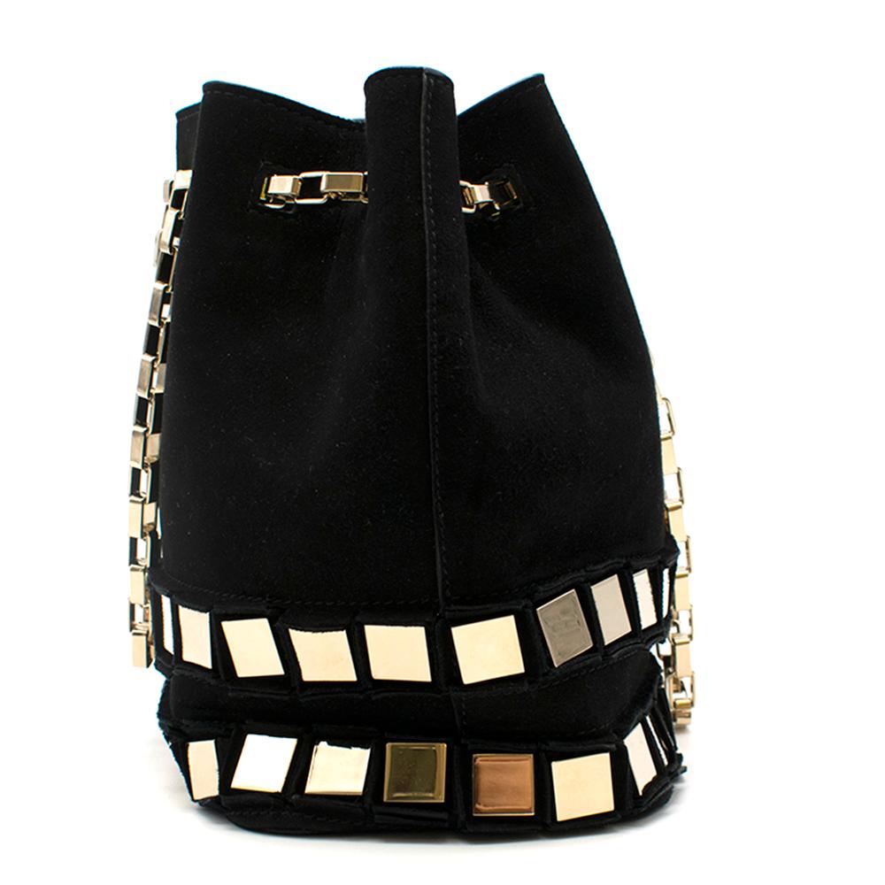 Tomasini Paris Suede Black Bucket Bag

Gold hardware link chain 
Gold square reflective squares at base
Chain pulls to close
Smooth interior and exterior

Please note, these items are pre-owned and may show signs of being stored even when unworn and
