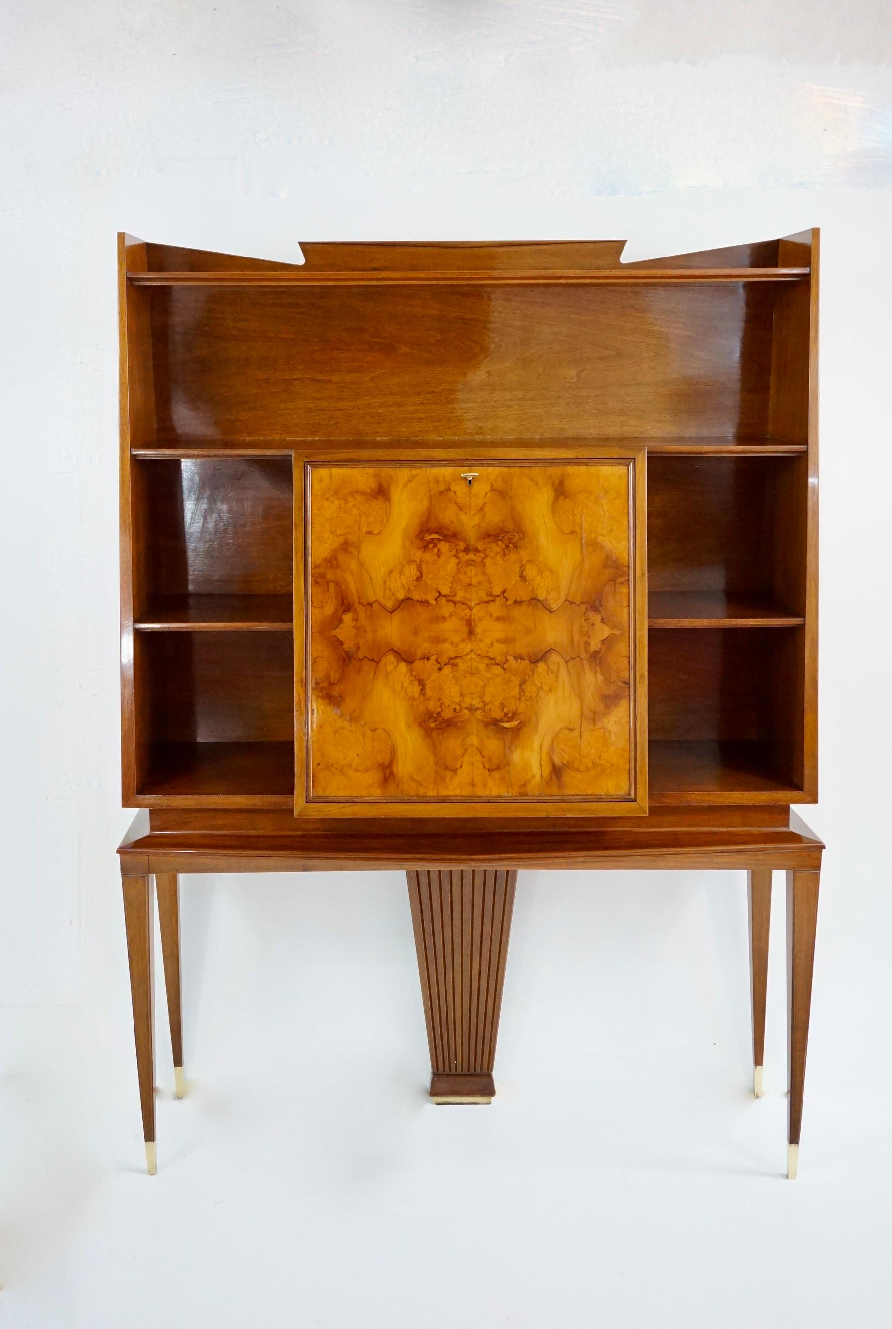 high and unique bookcase with cabinet designed by Tomaso Buzzi and Emilio Lancia circa 1940 
central door with a key for the secretere
elegant and unique piece in set with the sideboard
walnut, briar root veneered, brass and maple
the cabinet comes