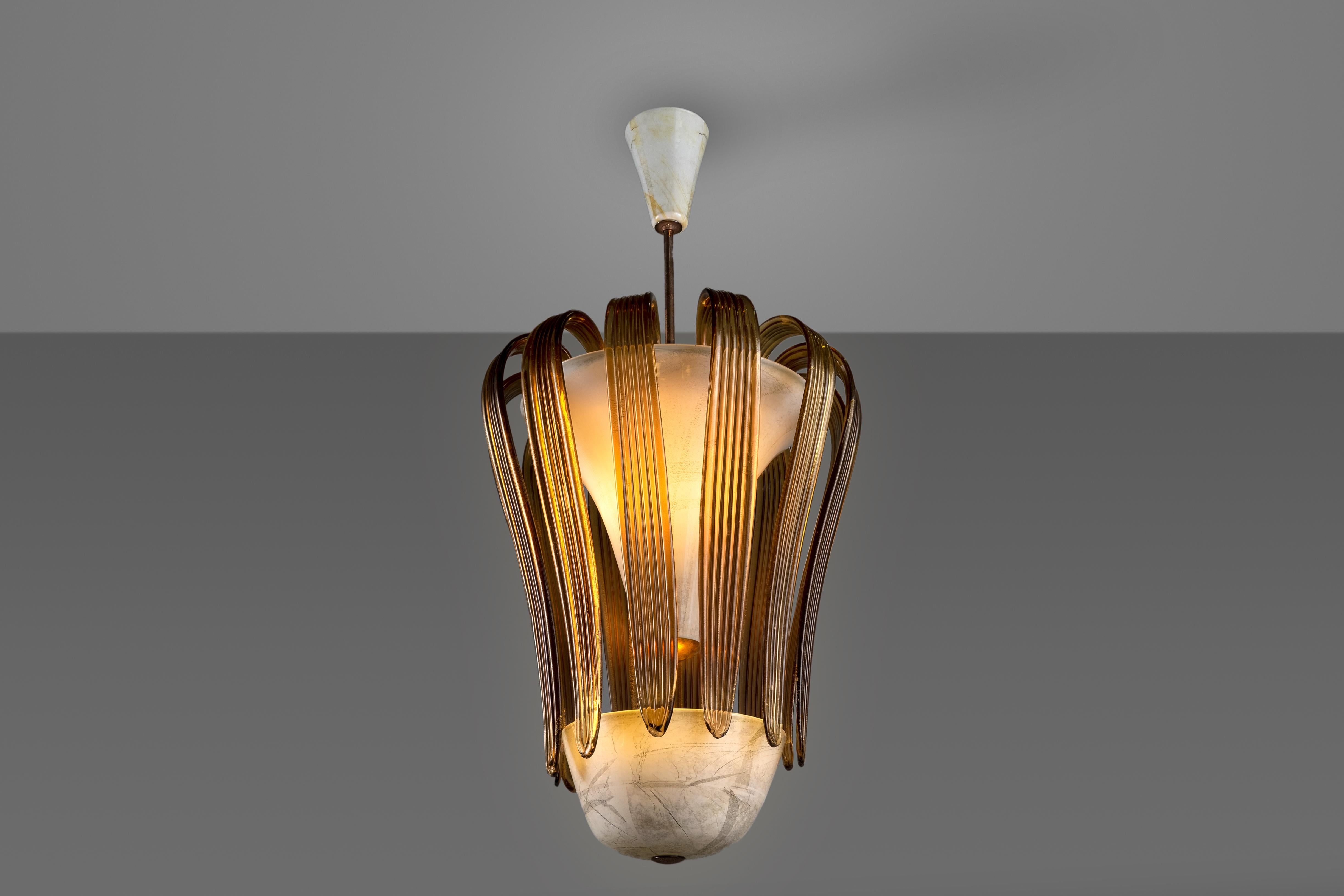 This amazing ceiling lamp designed by Tomaso Buzzi in the 30s for Venini. This item - the model 5204 - is made out entirely in Murano blown glass with diffusers in 'lattimo' (milk glass), silver and elements in creased stained glass. Its beauty and