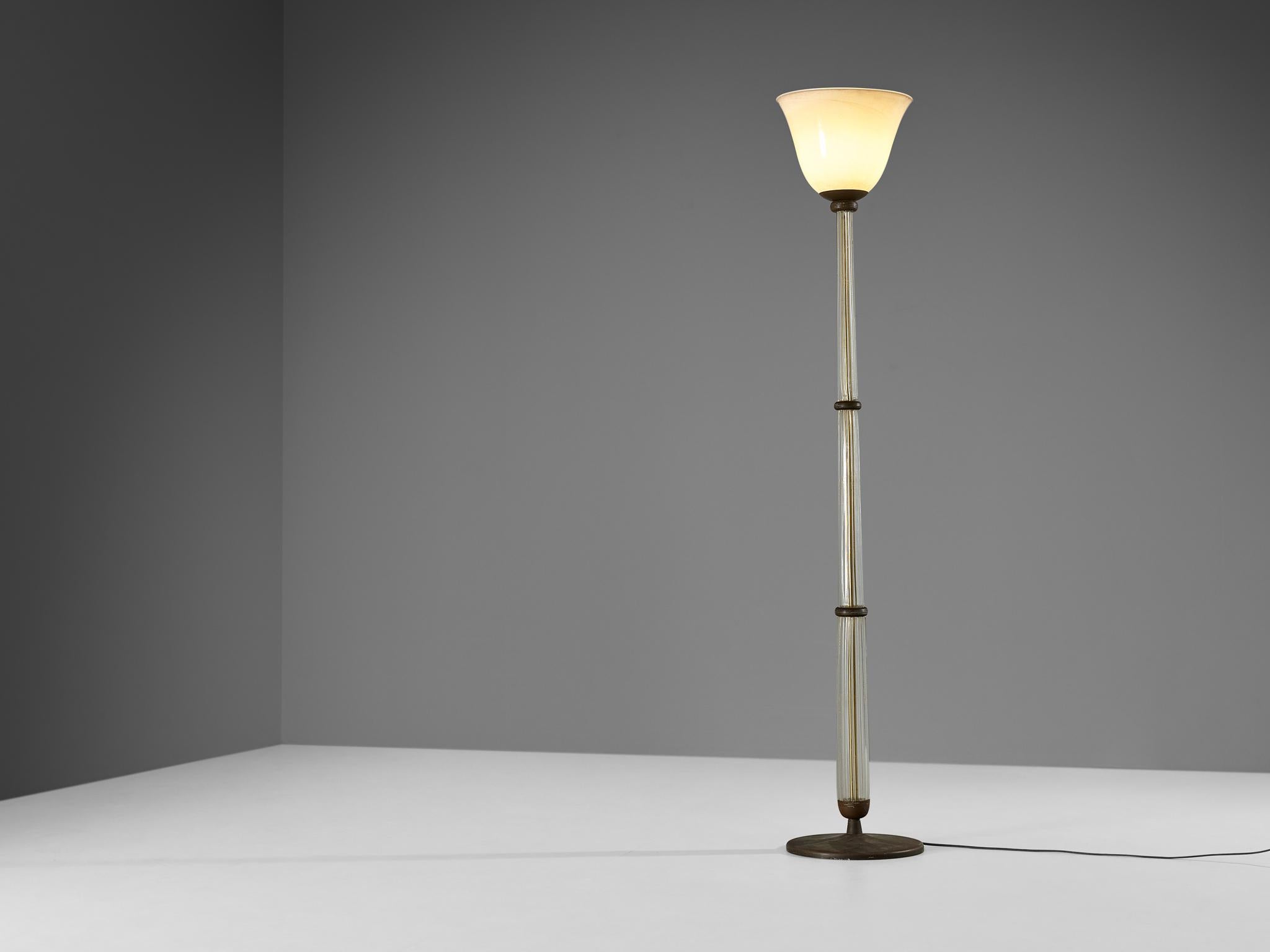 Tomaso Buzzi for Venini, floor lamp, model '502', glass, brass, gold leaf, Italy, 1933-38

A truly magnificent Italian floor lamp designed by the Milanese multidisciplinary artist Tomasso Buzzi (1900-1981) for the esteemed glass company Venini. With