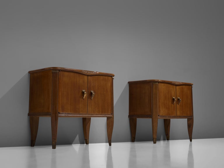Tomaso Buzzi, nightstands, walnut, Italy, 1940s

These two rare side tables or nightstands are both refined and elegant in every way. The brass detailing underneath the beautifully ornamented walnut table top, create a perfect harmony with the brass