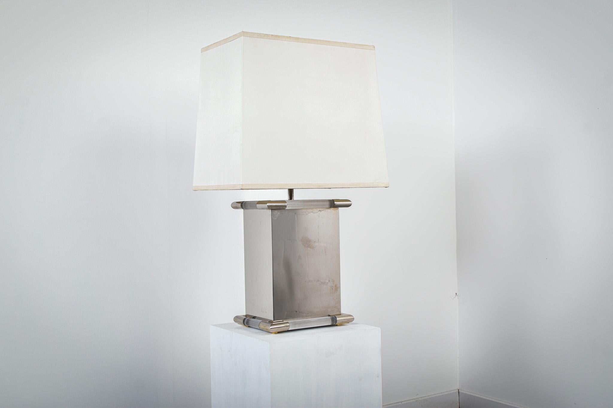Table lamp made from polished steel and lucite by Tomasso Barbi

The lamp is signed 'Tomasso Barbi' on the underside of the lamp

Made in Italy in the 1980's