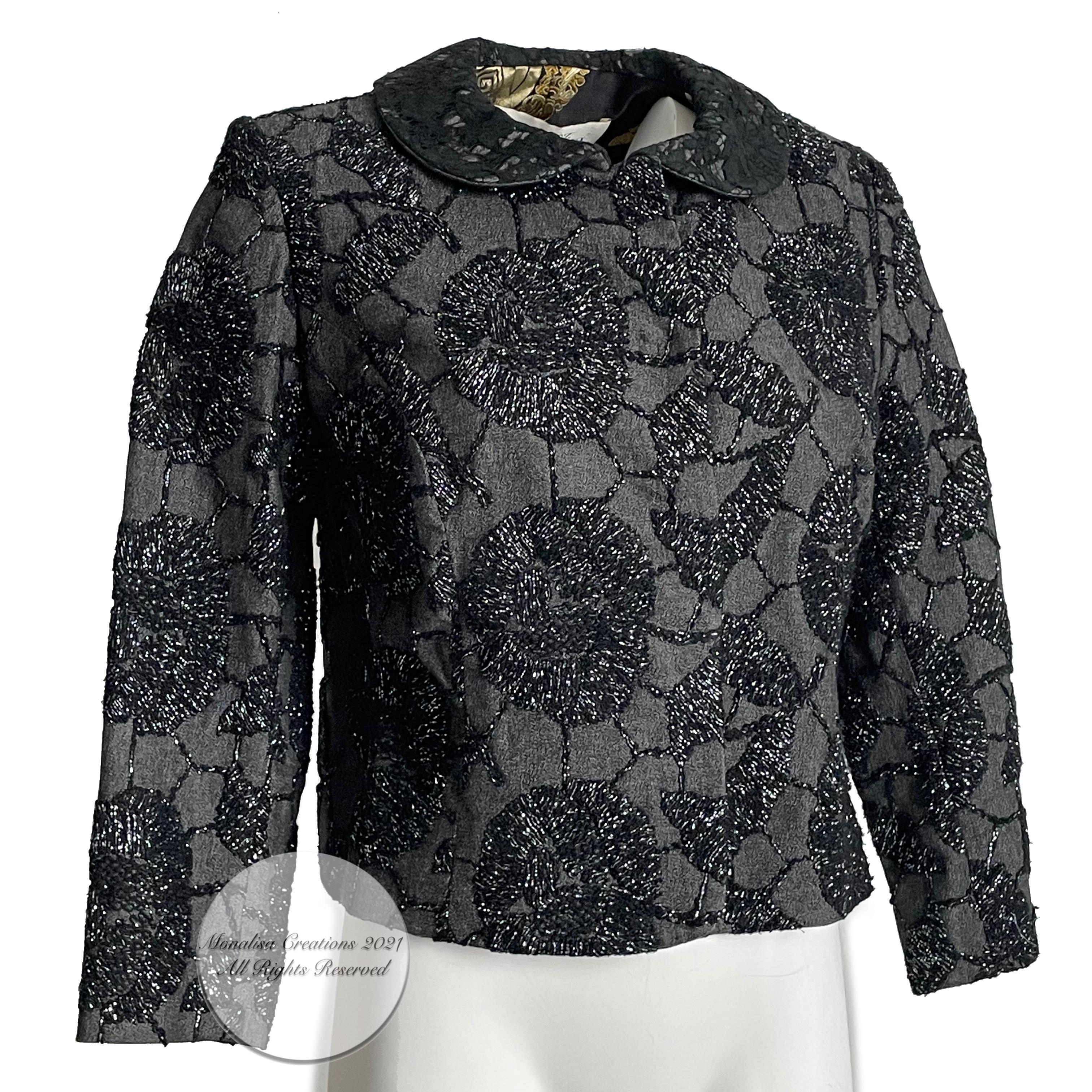 Fabulous and unique cropped jacket by UK designer Tomasz Starzewski, who designed for the late Princess of Wales amongst other members of the Royal Family. The exterior features intricate metallic-thread embroidered florals against a charcoal