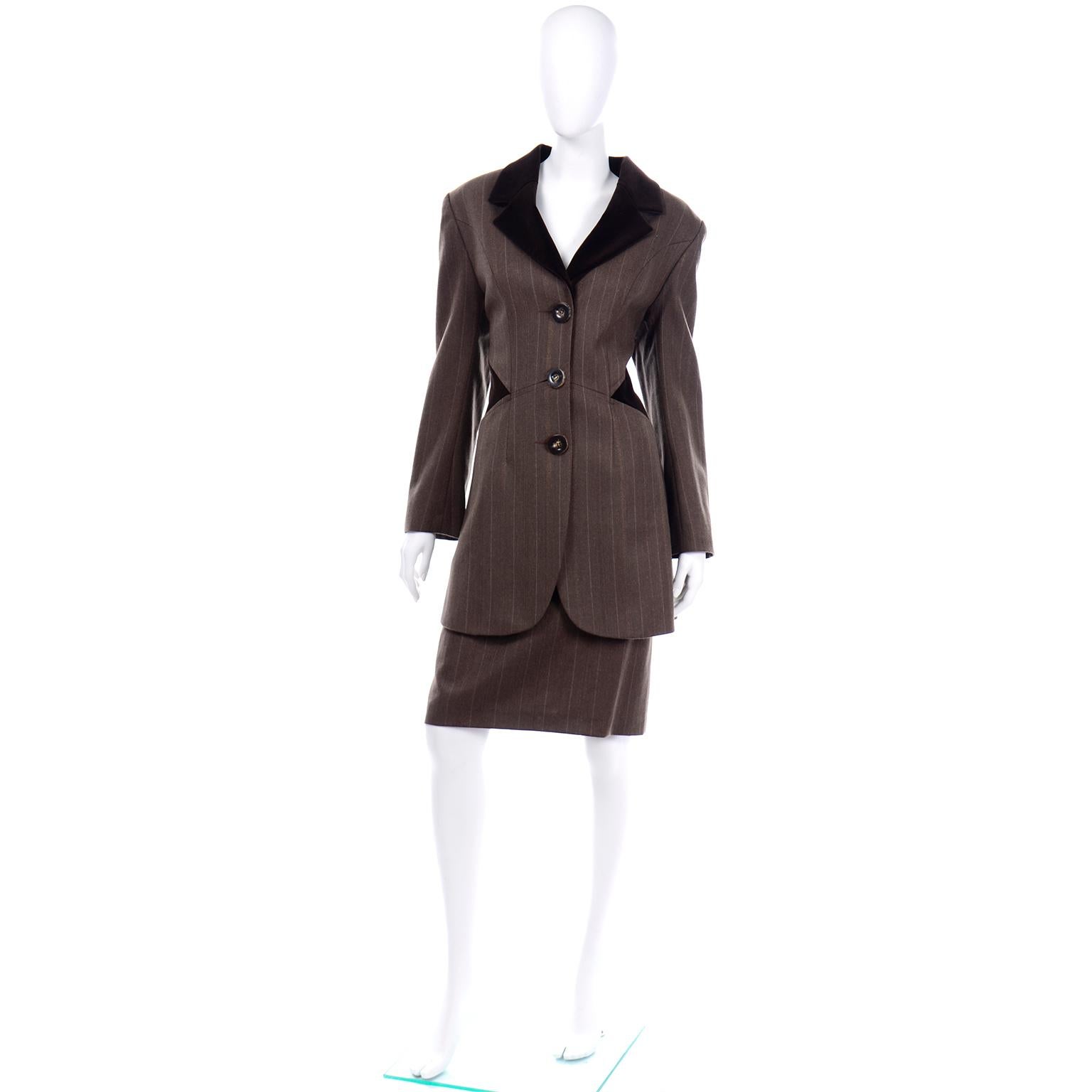 This vintage Tomasz Starzewski skirt suit includes a really fabulous equestrian style longline coat and a slim skirt. The lapels of the coat are brown cotton velvet and there  is also a diamond velvet detail along the sides of the waist. The pin