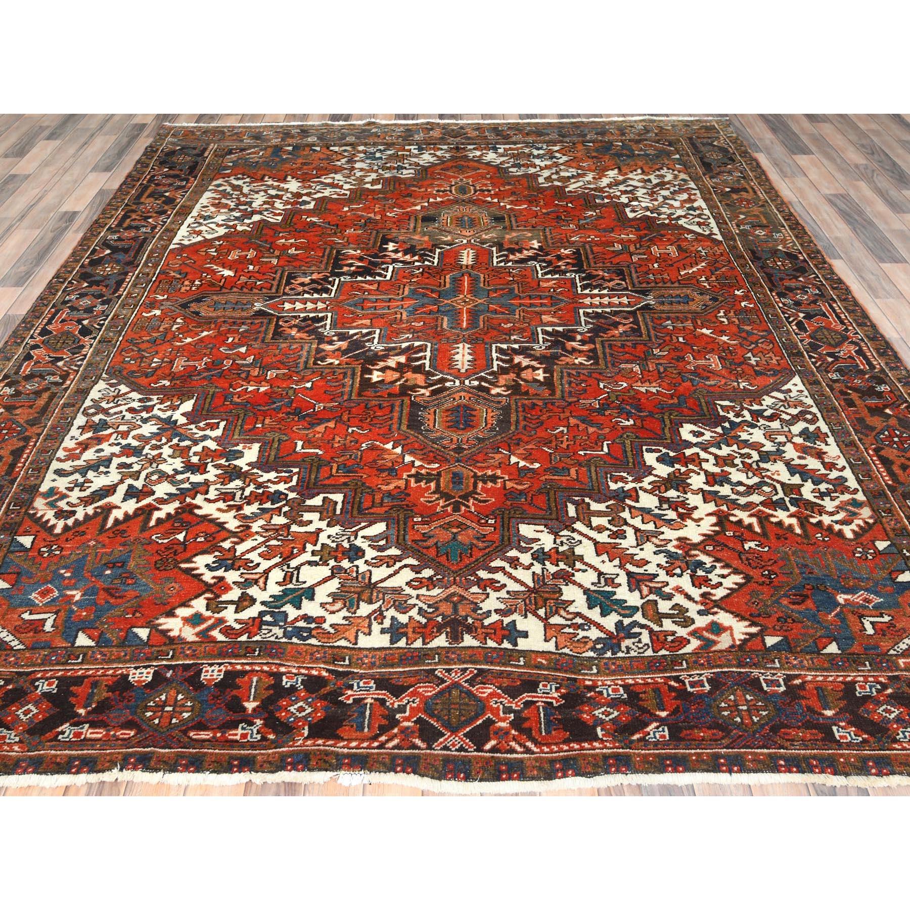 Heriz Serapi Tomato Red Worn Wool Hand Knotted Old Persian Heriz Professionally Cleaned Rug For Sale