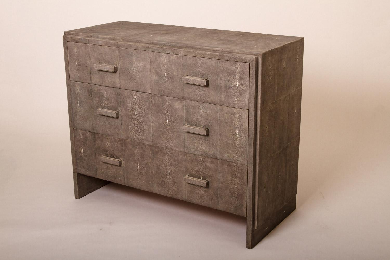 The Tomboy chest of drawers in coal black shagreen is a Classic piece that would suit any living style. The simplicity of the piece allows for the rich shagreen inlay to speak for itself. This chest is extremely piratical including 2 drawers on the