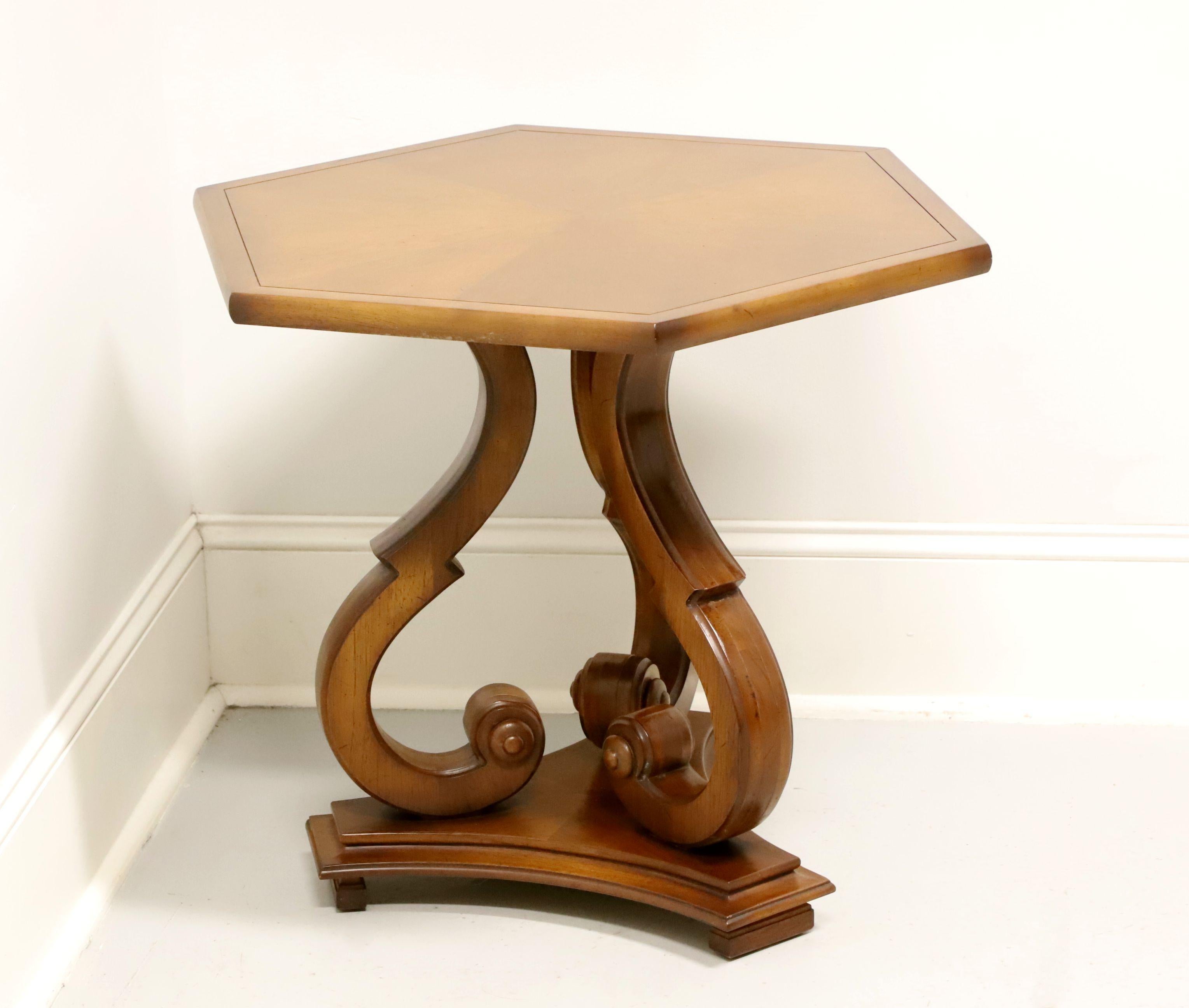 A Neoclassical style side table by Tomlinson Furniture. Walnut, or similar nutwood, with their Nutmeg finish, hexagon shaped banded & inlaid flame wood top, and three scroll like legs resting on a triangular shaped solid base forming a pedestal.