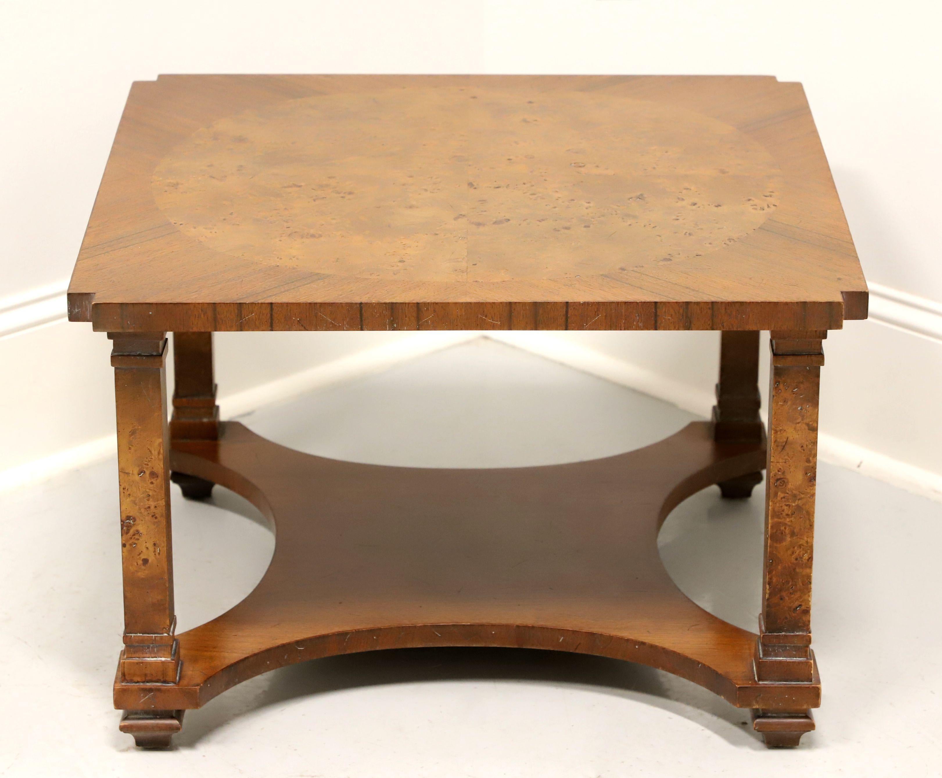 A Neoclassical style square coffee table by Tomlinson Furniture. Walnut with slight distressing, inlaid burlwood top, clipped corners, inlaid burlwood to column like legs and an undertier modified 