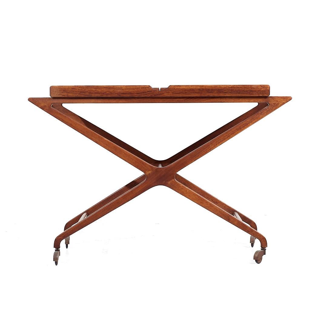 Tomlinson Sophisticate Mid Century Walnut Expanding Bar Cart

This bar cart measures: 42.75 wide x 18.25 deep x 29 inches high, each leaf measures 13.375 inches wide, making a maximum bar cart width of 69.5 inches when both leaves are expanded

All