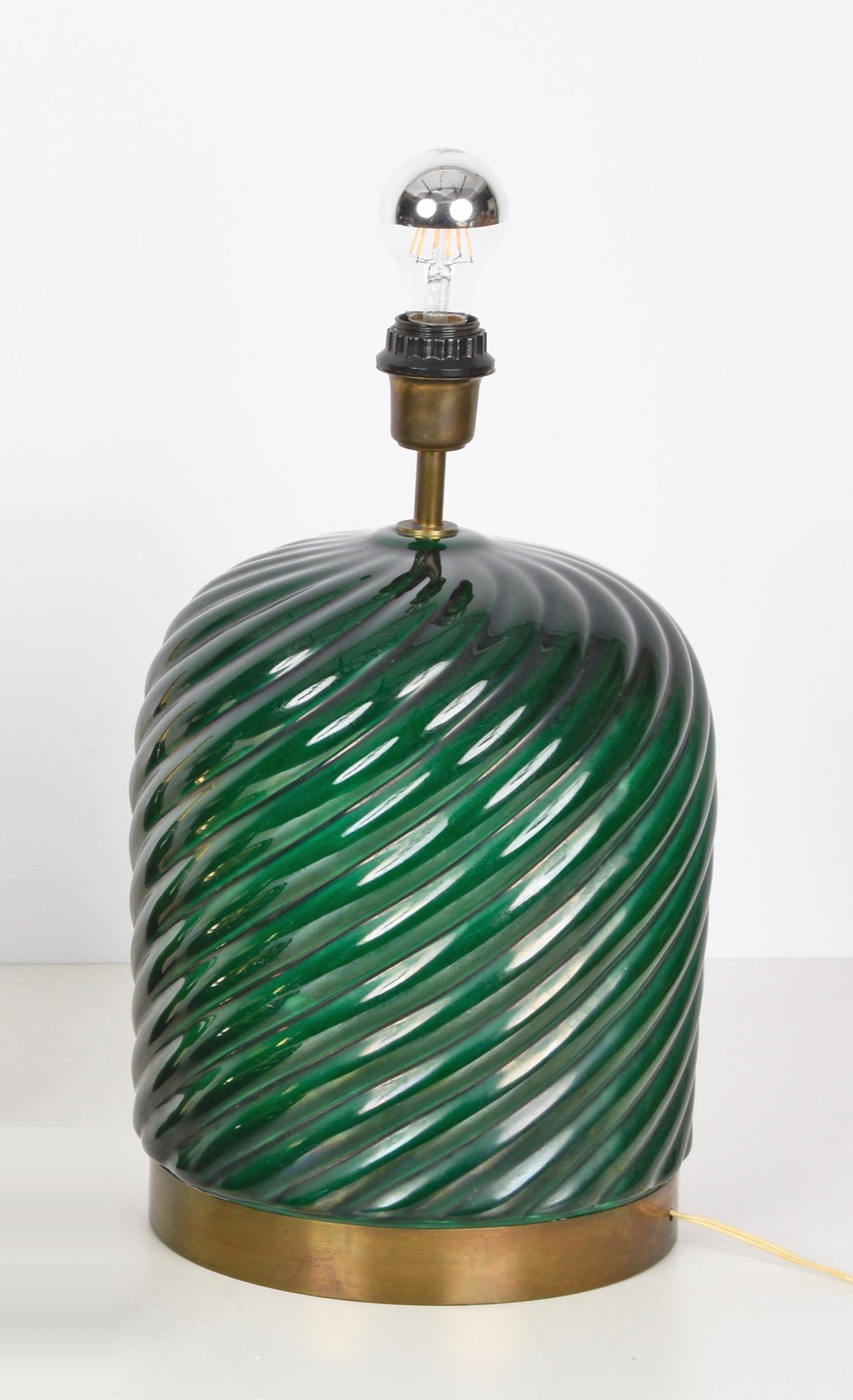 Amazing midcentury modern green ceramic and brass table lamp without shade. This fantastic piece was designed by Tommaso Barbi and produced by B. Ceramiche during the late 1960s in Italy.

The brand of the manufacturer is inside the lamp, while on