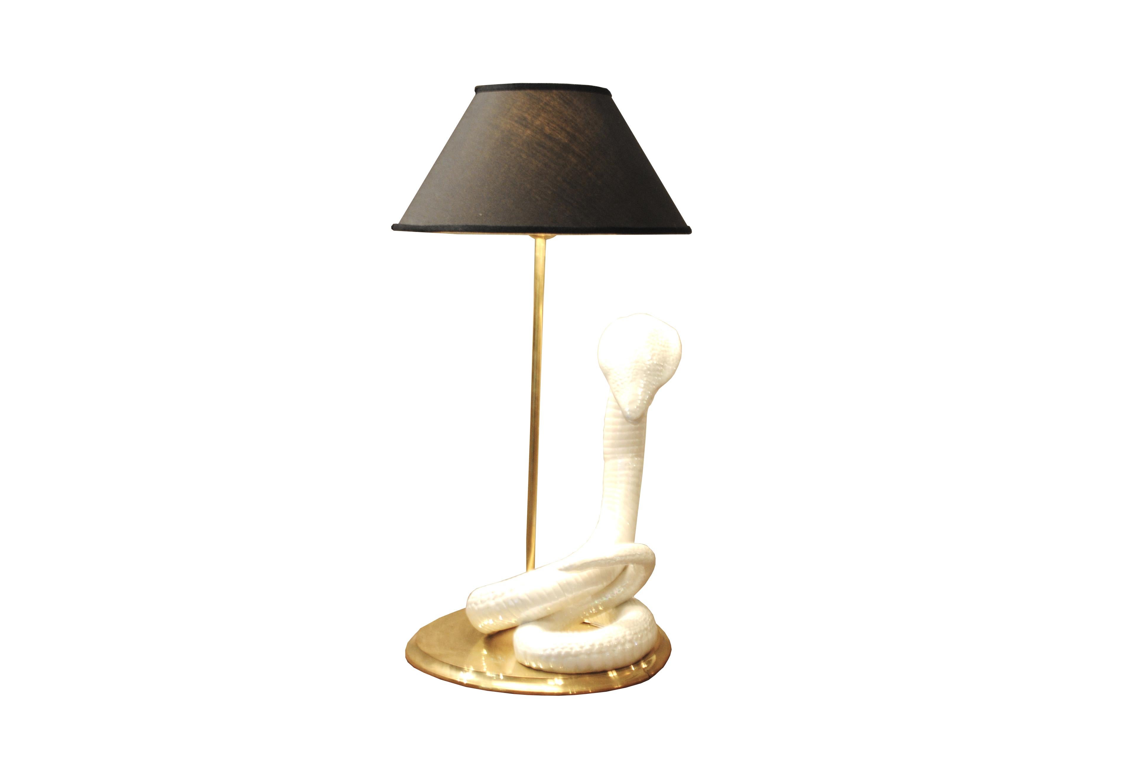 Nice table lamp in ceramic and brass a cobra refining, by the Italian designer Tommaso Barbi.