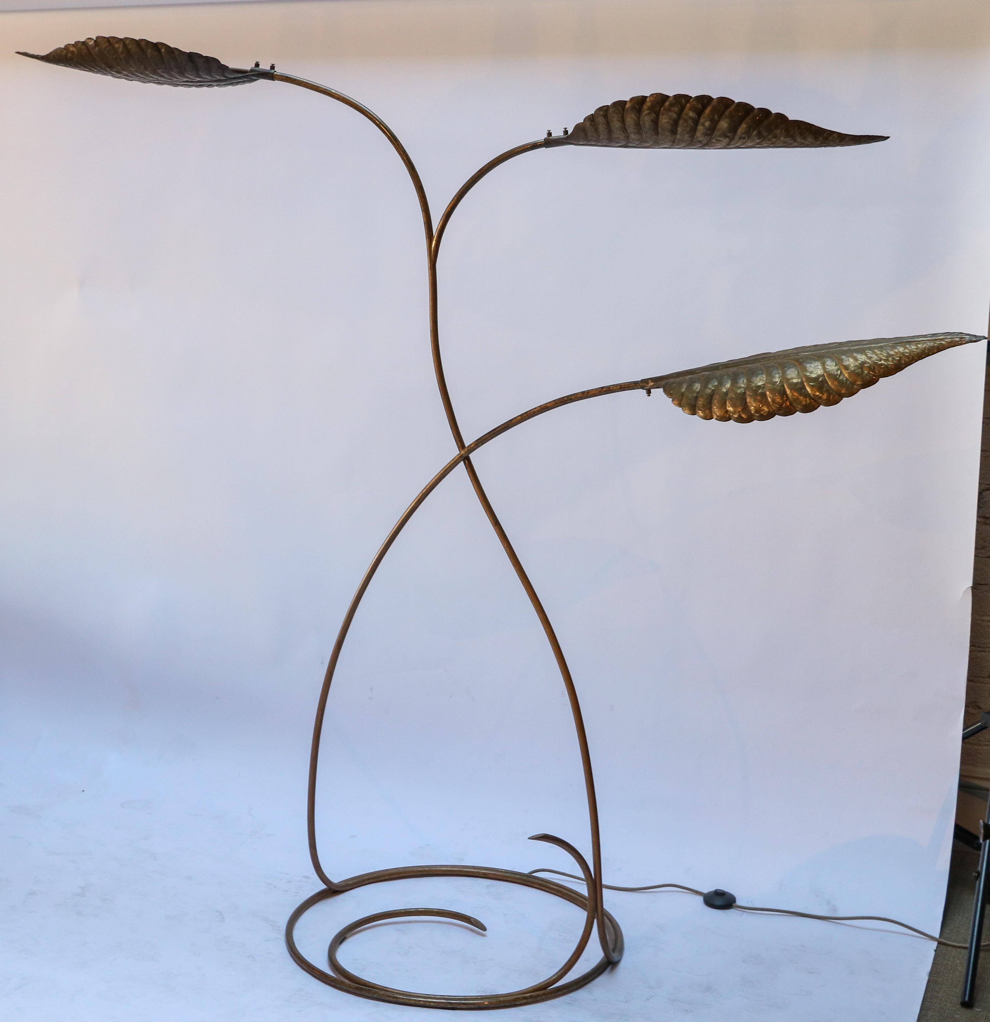 1970s Italian brass floor lamp by Tommaso Barbi with three leaves or lights on a circular base.

Measures: Base diameter 26.5