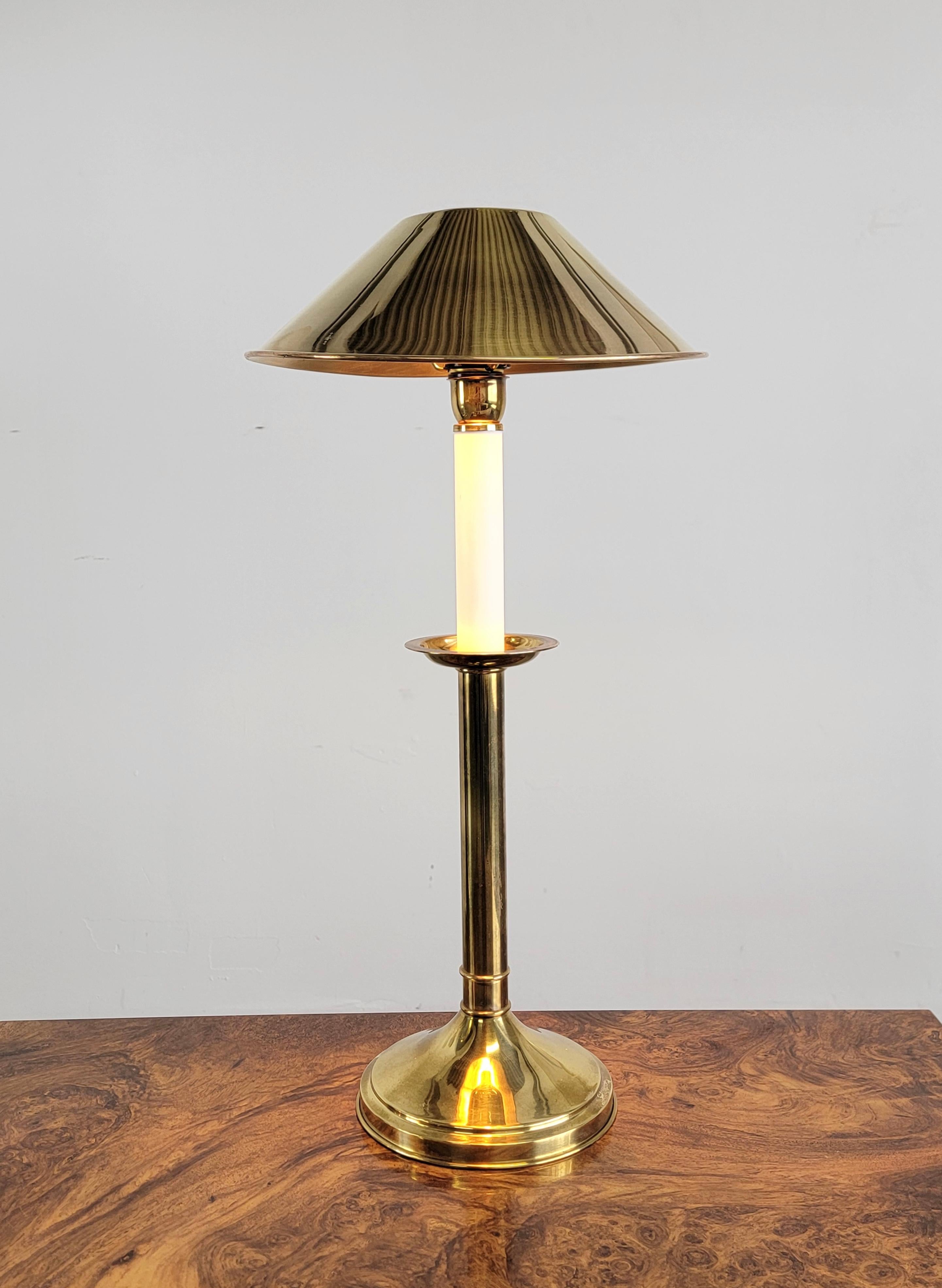 Rare Tommaso Barbi brass table lamp made in the 1970s. This stunning lamp is finished in brass with a lacquer detail.  It’s stamped ‘Tommaso Barbi, made in Italy’ at the bottom of the base. The brass body is in overall good condition, there’s some