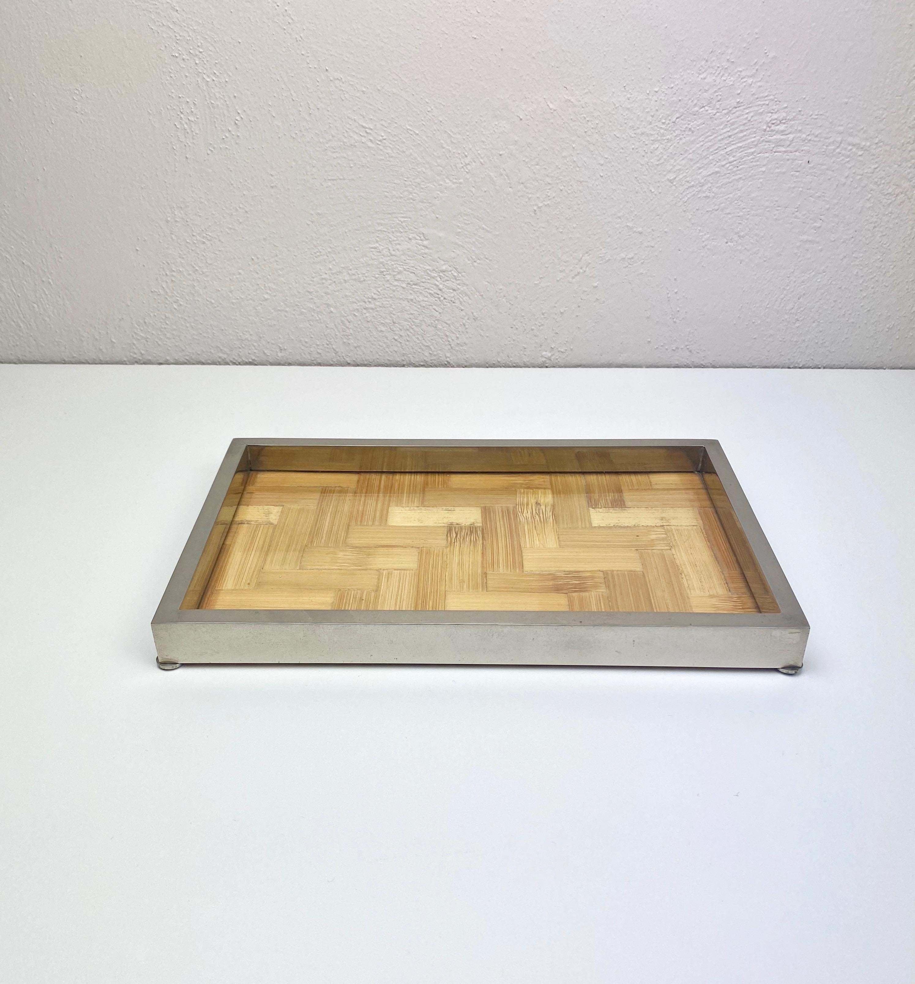 Centrepiece tray by the Italian designer Tommaso Barbi (original label still attached) in chrome, glass and bamboo. Made in Italy in the 1970s.