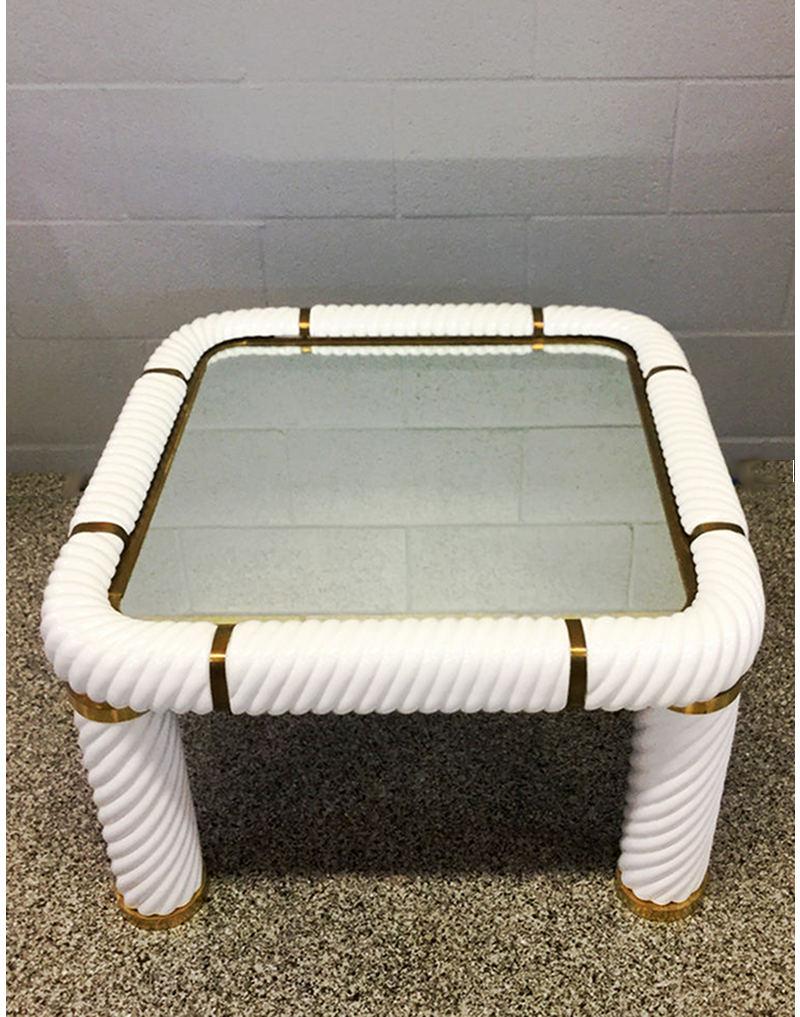 Square coffee table with mirrored top and fine ceramic and brass finish