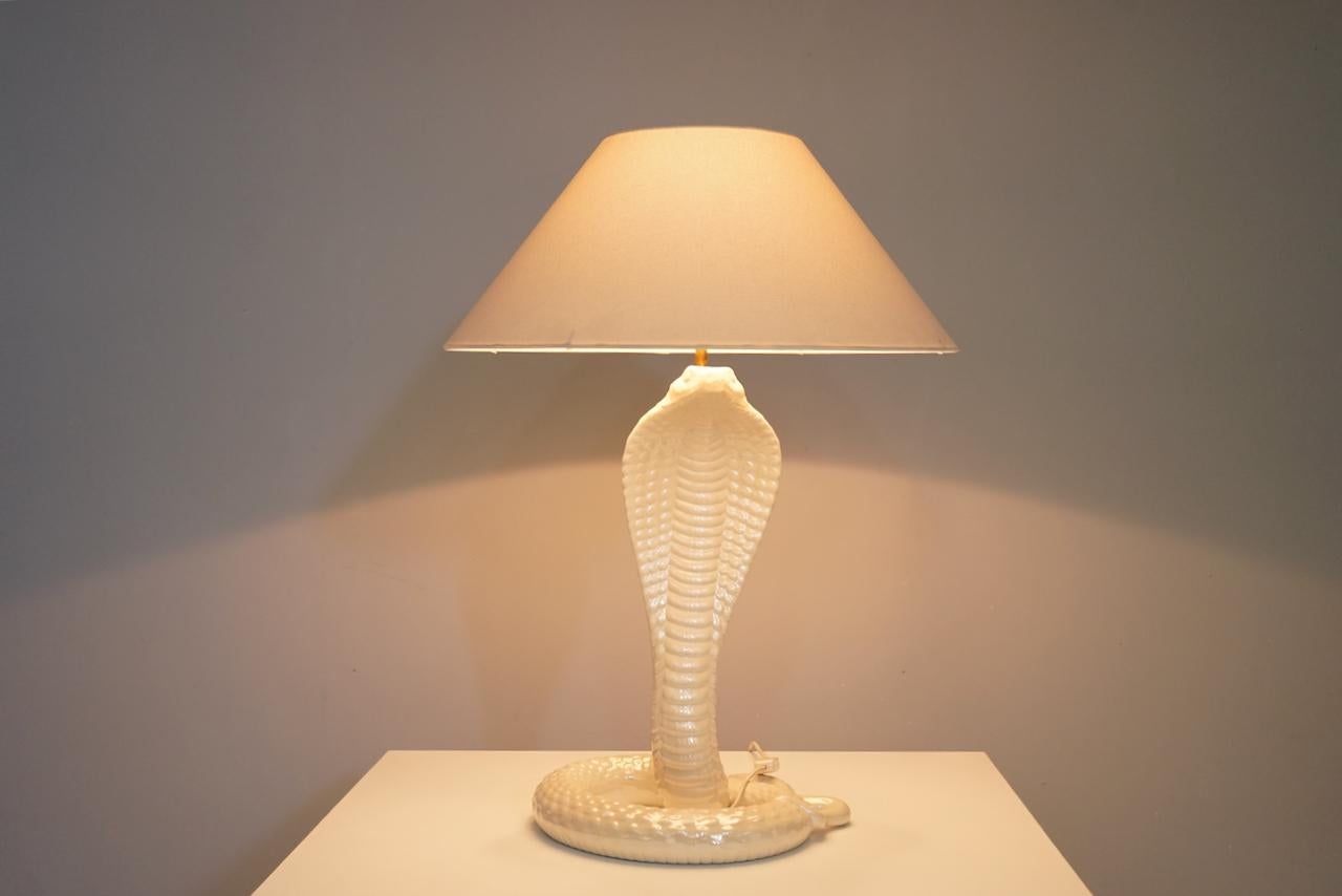 Ceramic Cobra table lamp with original shade by Tommaso Barbi, Italy, 1970s.
Good condition.