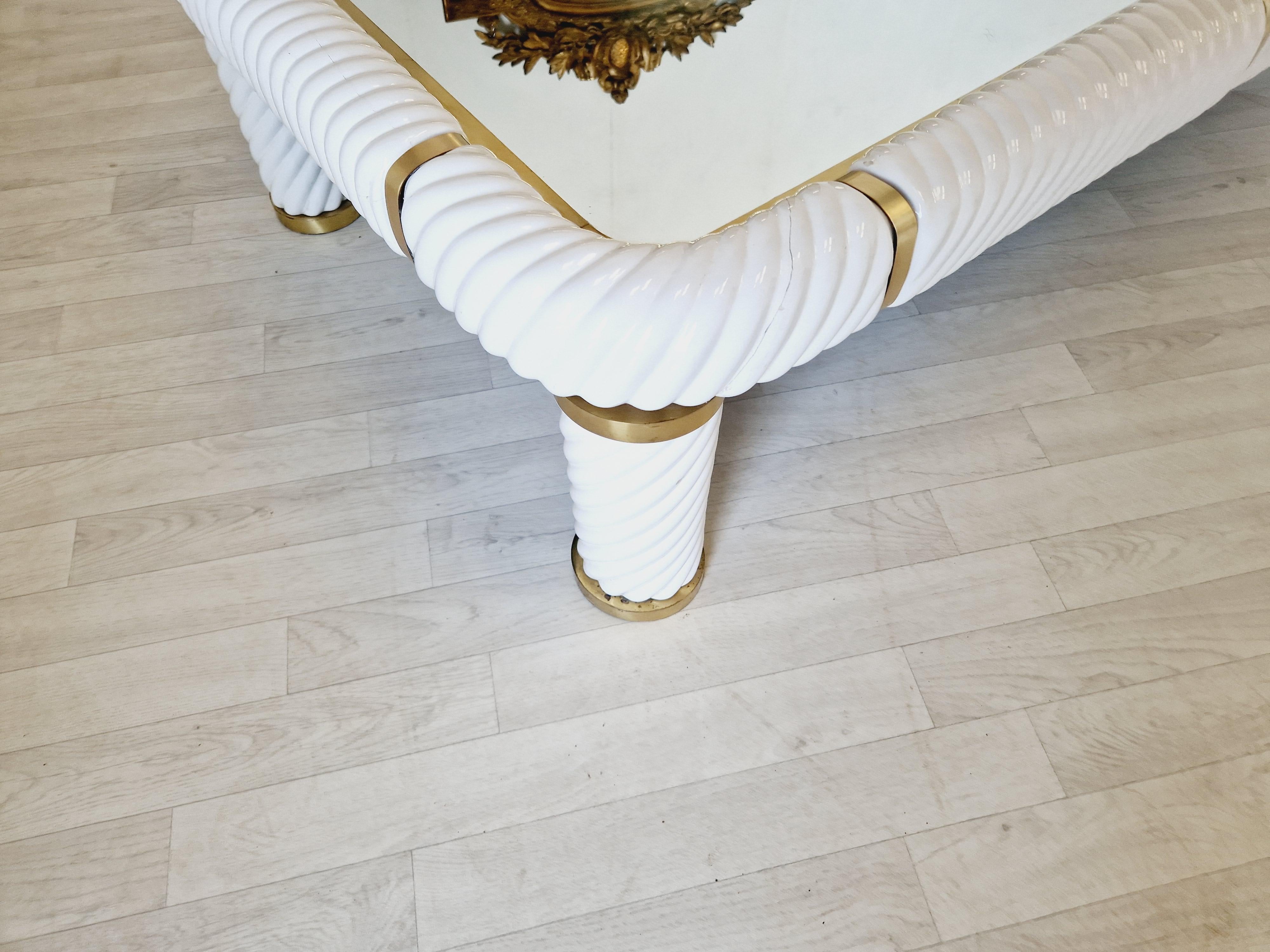 This vintage large Tommaso Barbi coffee table in white ceramic and brass is a stunning addition to any room. The rectangular shape and fully assembled design make it a convenient and practical choice. The table features one of Barbi's signature