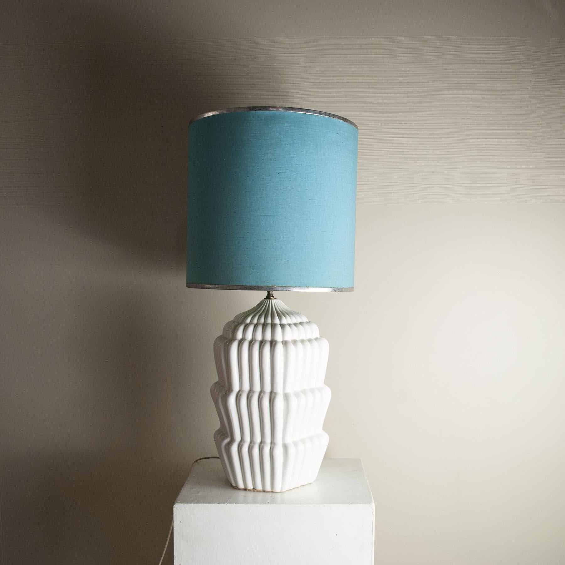 Italian 1960s table lamp made of glazed ceramic and brass, depicting a cake design Tommaso Barbi
The lamp is sold without the lampshade in the photo, but it can be requested in the shape sizes and colors as desired with an extra charge.

n.b.