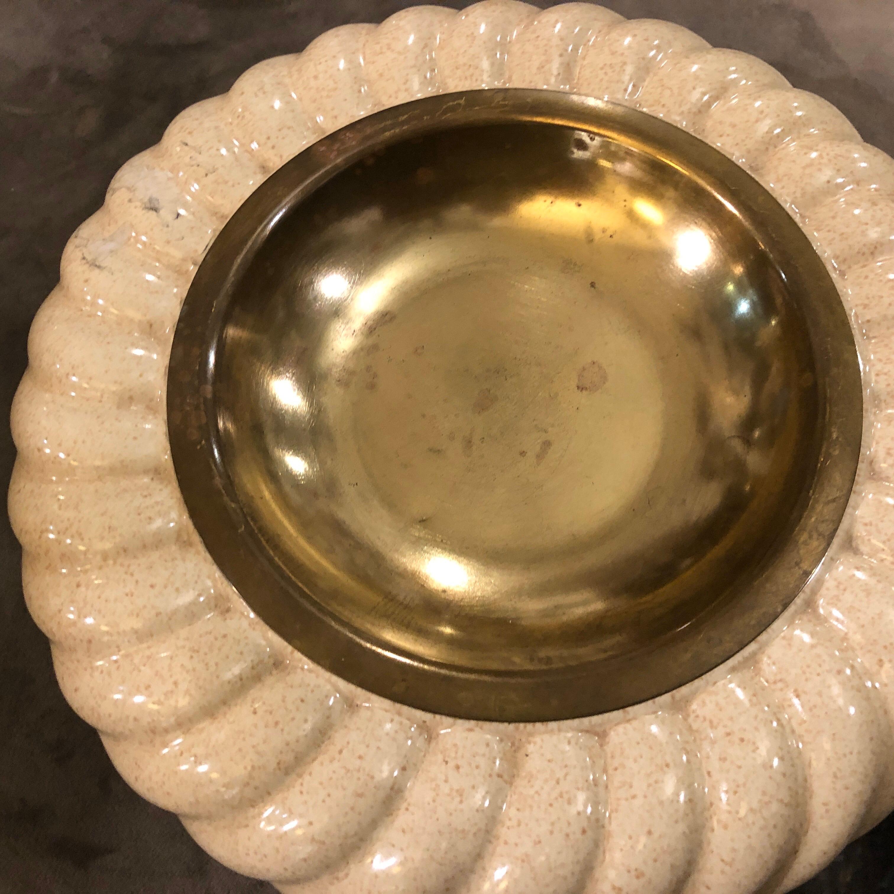 Iconic Tommaso Barbi ashtray made in Italy in the 1970s, porcelain has signs of age, brass is in original patina. It's marked on the bottom.