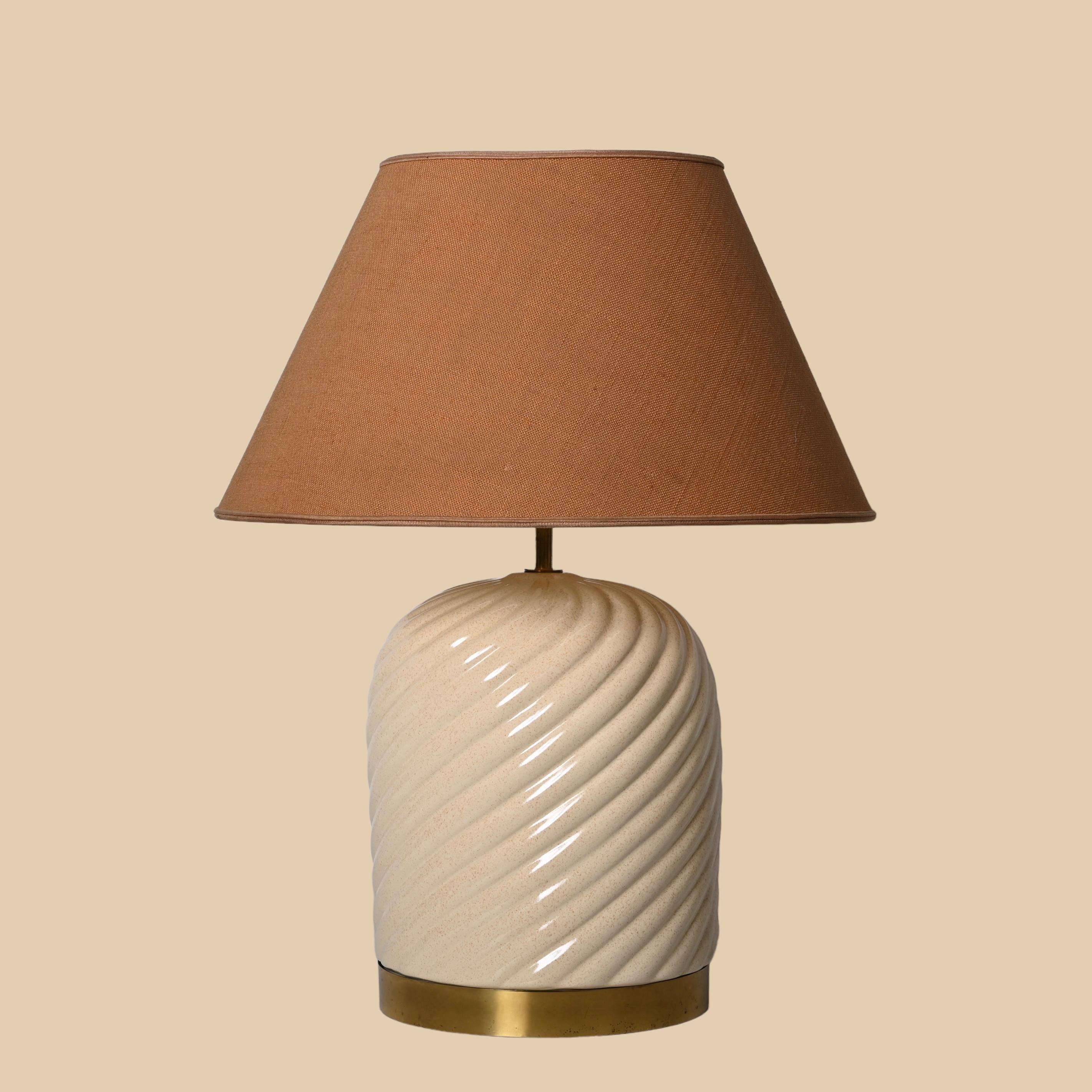Amazing mid-century white ceramic table lamp. Tommaso Barbi designed this fantastic piece for a B. Ceramiche production during the late 1960s in Italy.

The manufacturer's branding is shown on the inside of the lamp, while the vivid white cream of