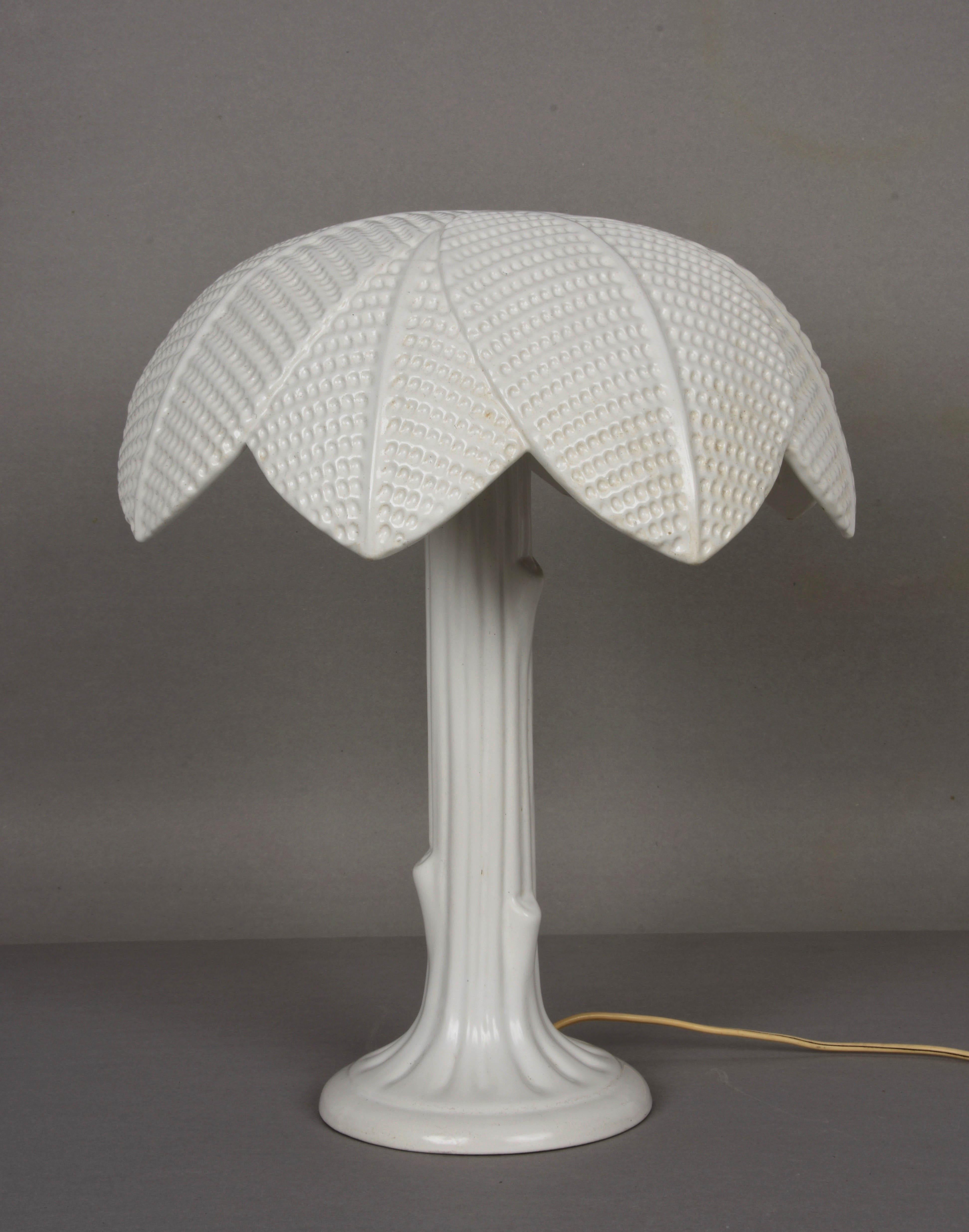 Beautiful white glazed ceramic table lamp in the shape of a palm tree. This fantastic item was designed and signed by Tommaso Barbi for a B Ceramiche Italian production from the 1970s.

This piece is one of a kind because of the attention to
