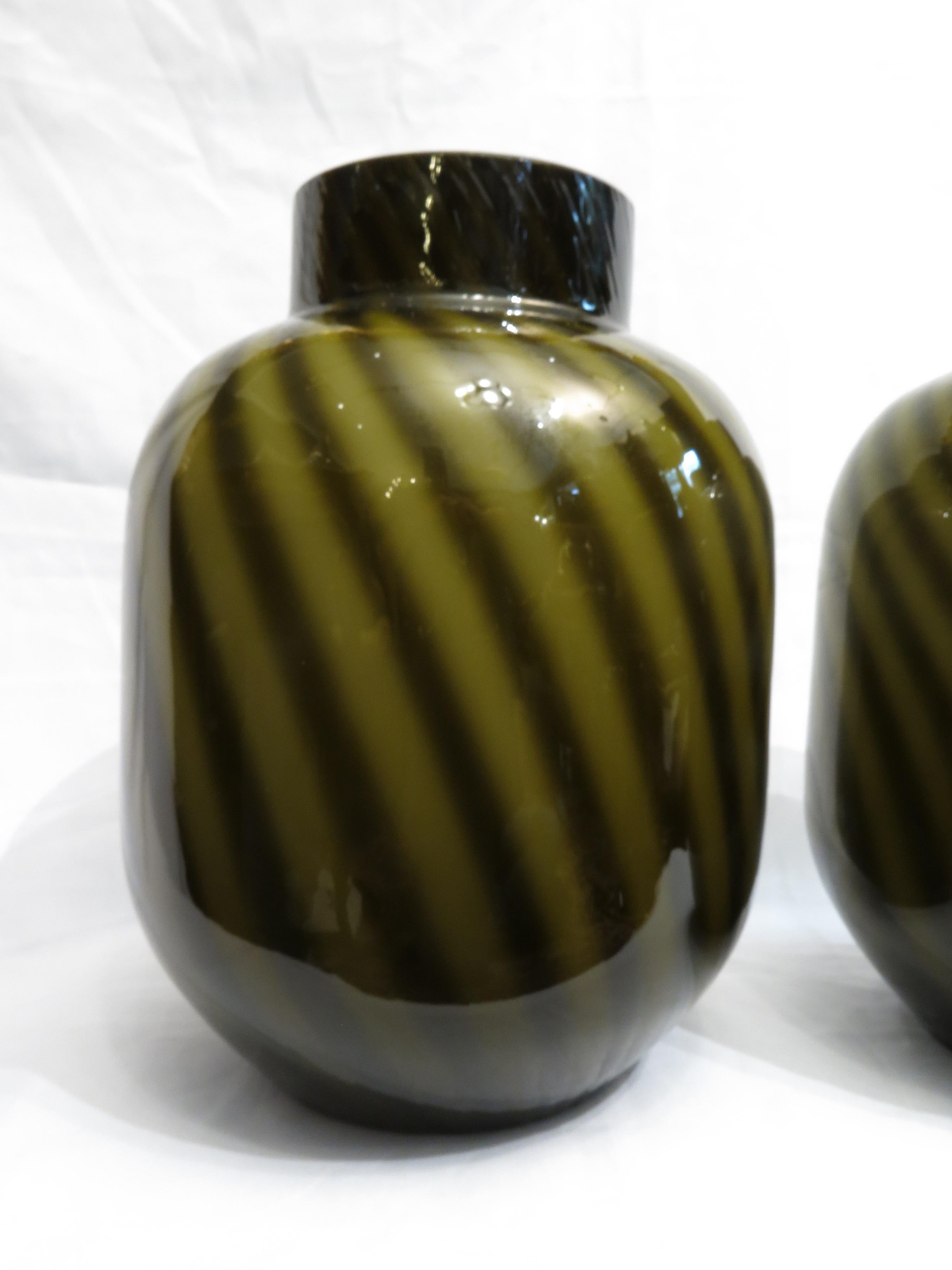 Decorative and quite rare pair of vases by Tommaso Barbi, Italy, Murano, 1970s.
Green shades.