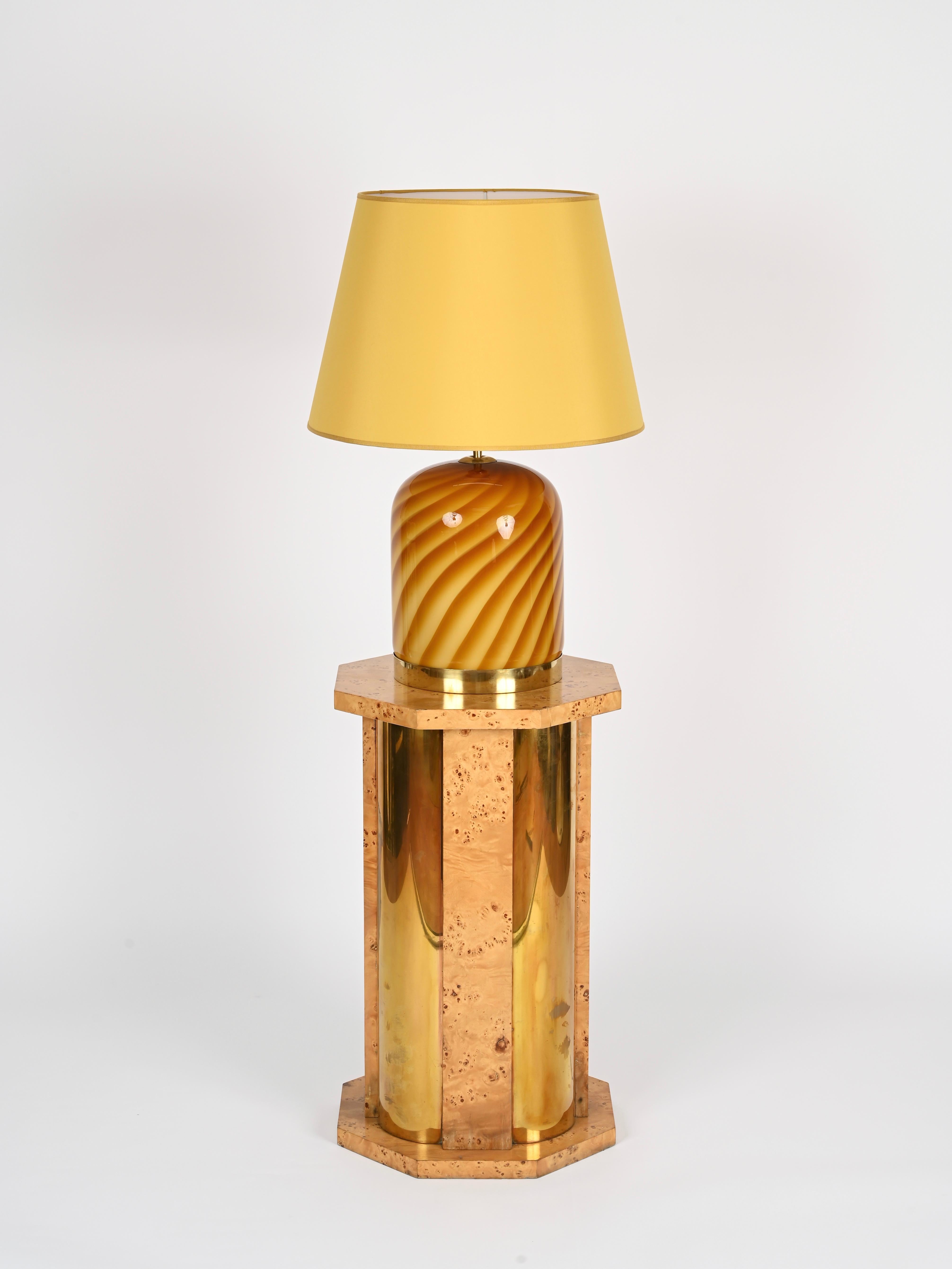 Incredible octagonal pedestal table in brass and birch burl. This incredibly stylish and versatile piece was designed by Tomasso Barb and produced in Italy during the 1970s. Signed on the bottom.

This unique pedestal is crafted from birch burl wood
