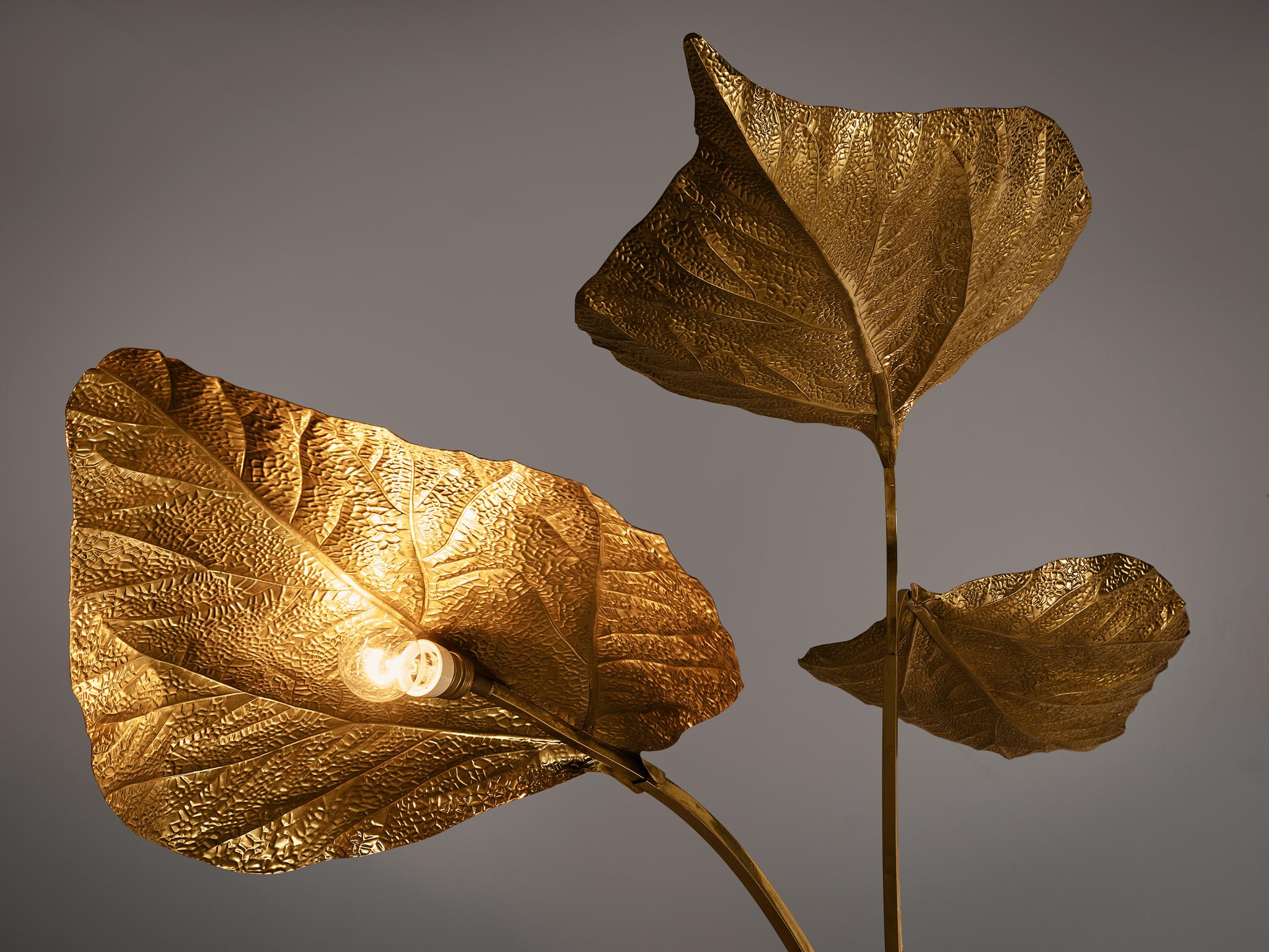 Tommaso Barbi, organic leaf floor lamp, brass, Italy, 1970s

Very elegant hammered brass floor lamp, presenting large rhubarb leaves. The extravagant style and amazing craftsmanship is characteristic for Tommaso Barbi's work.  The standing lamp has