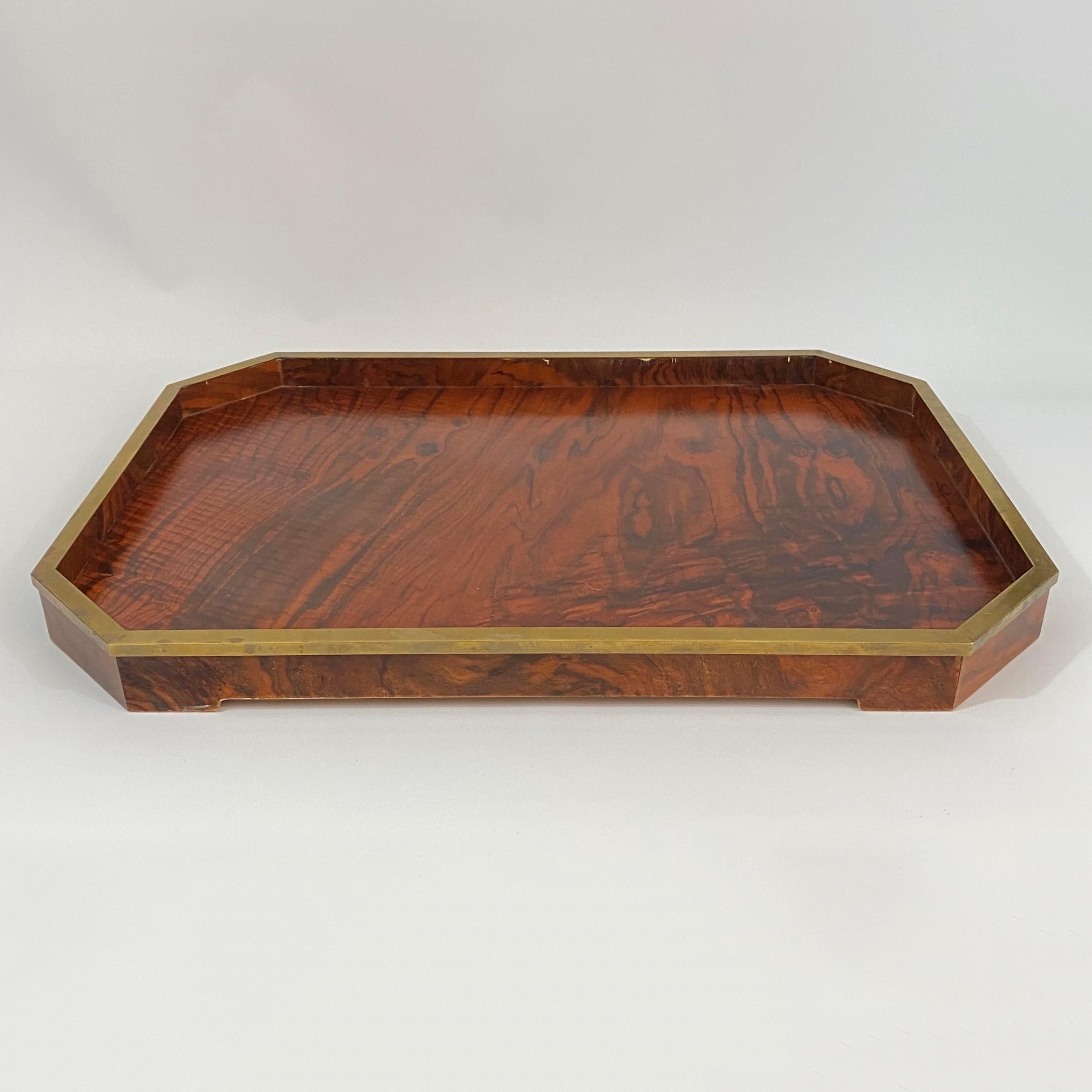Rare Tommaso Barbi rosewood tray with brass detail. Large tray with raised foot detail and brass trim that follows the entire edge of tray.

This item includes restricted materials and can not be sold outside of the contiguous United States. 