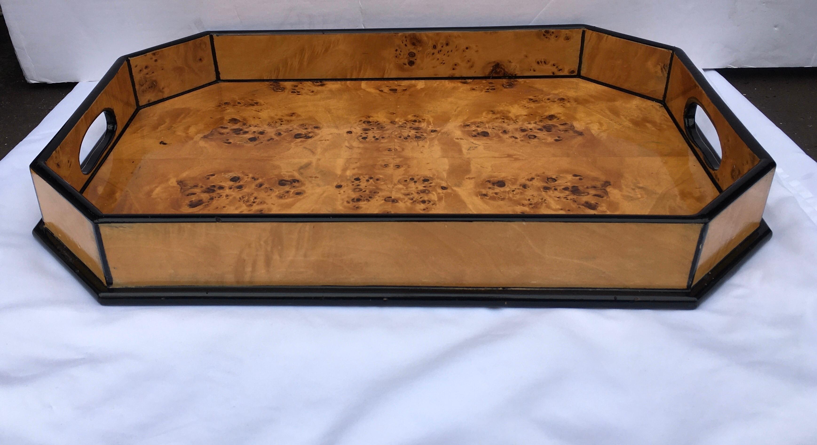 Vintage burl wood serving tray in the style of Tommaso Barbi. This octagon shaped bar ware tray features a lacquered gloss finish with black trim detailing. A handsome serving or bar piece. Would also make a beautiful ottoman tray.