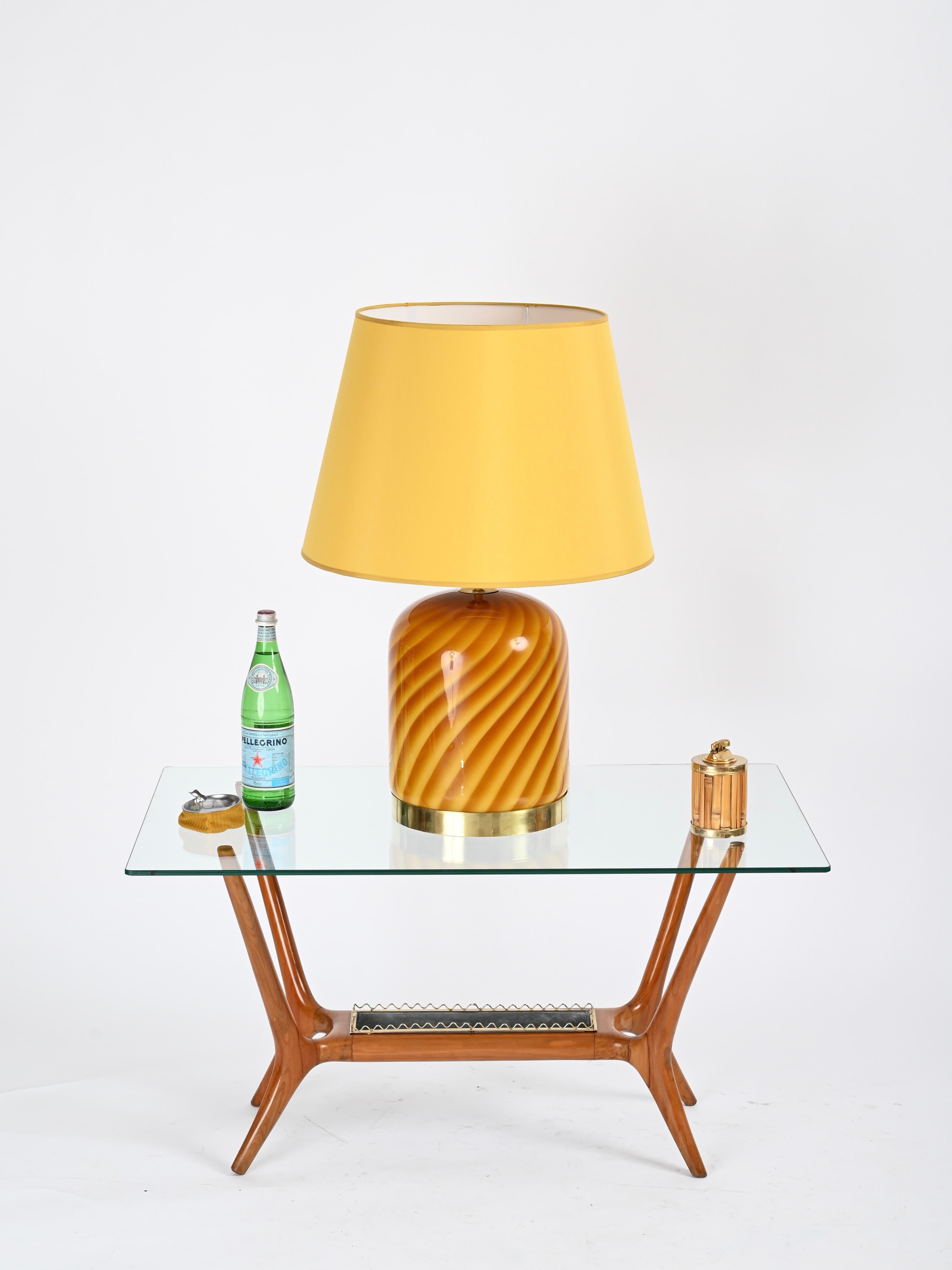 Spectacular mid-century large table lamp in Murano mouth-blown orange and yellow glass and brass. This incredibly rare and stylish lamp was designed by Tommaso Barbi and produced during the 1960s. The lamp is signed inside.

In fabulous condition,