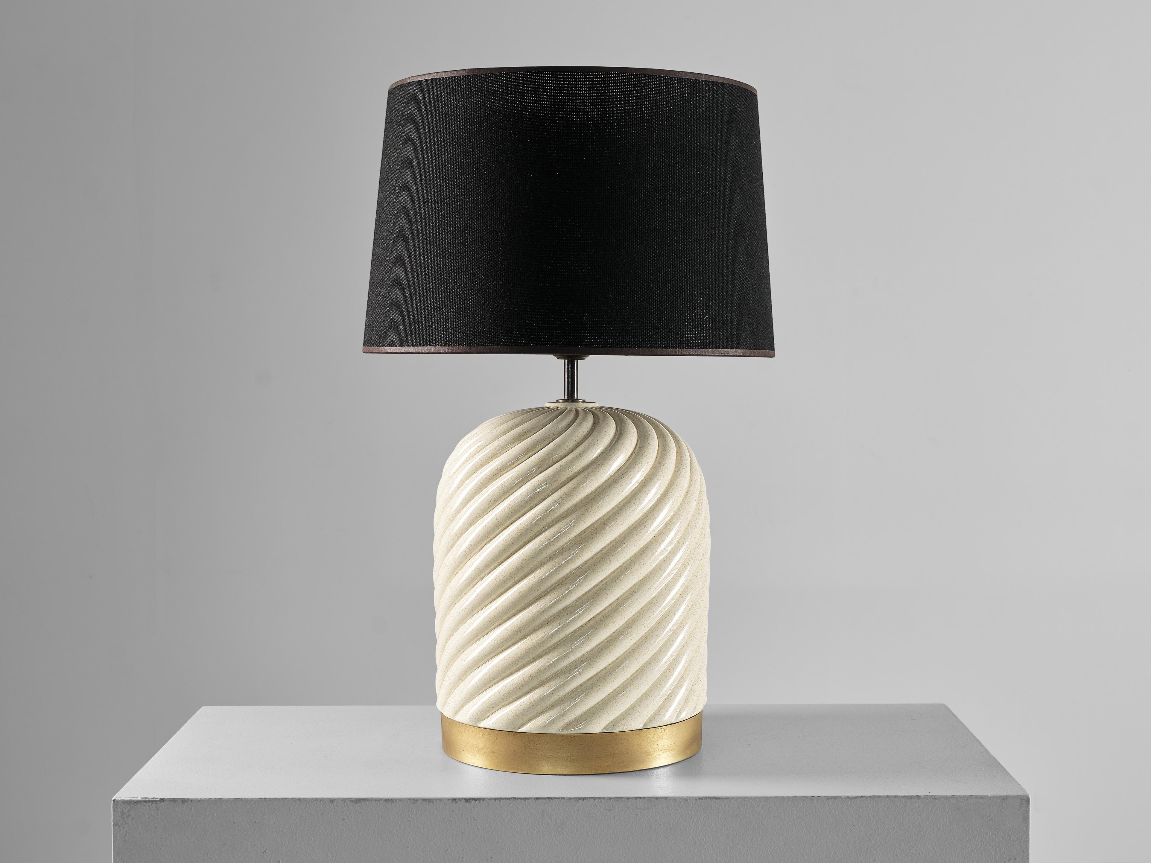 Tommaso Barbi for B Ceramiche, table lamp, brass, ceramic, plastic, Italy, 1970s 

Outstanding table lamp designed by the talented Italian designer Tommaso Barbi. The table lamp has a spiral structure executed in crème ivory colored ceramic with