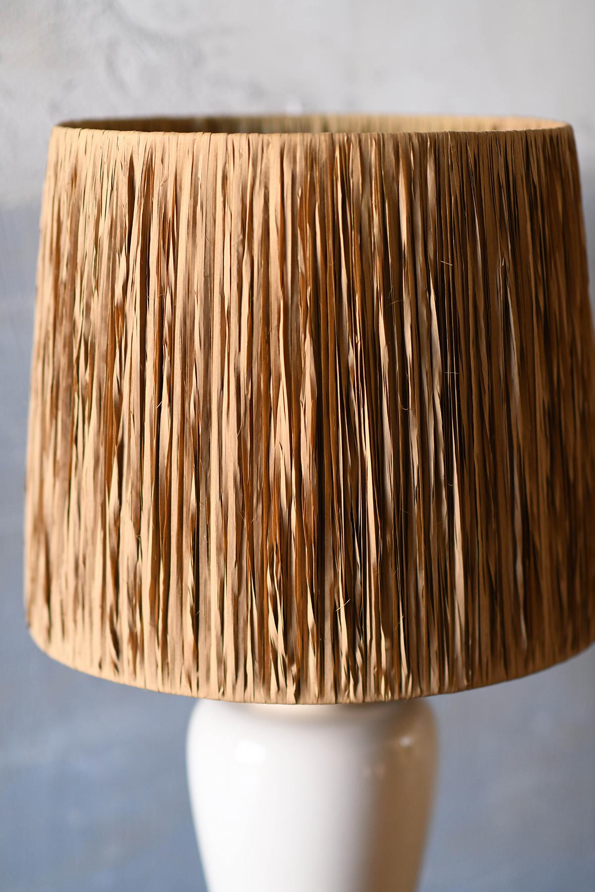 20th Century Tommaso Barbi table lamp in ceramic complete with raffia lampshade For Sale