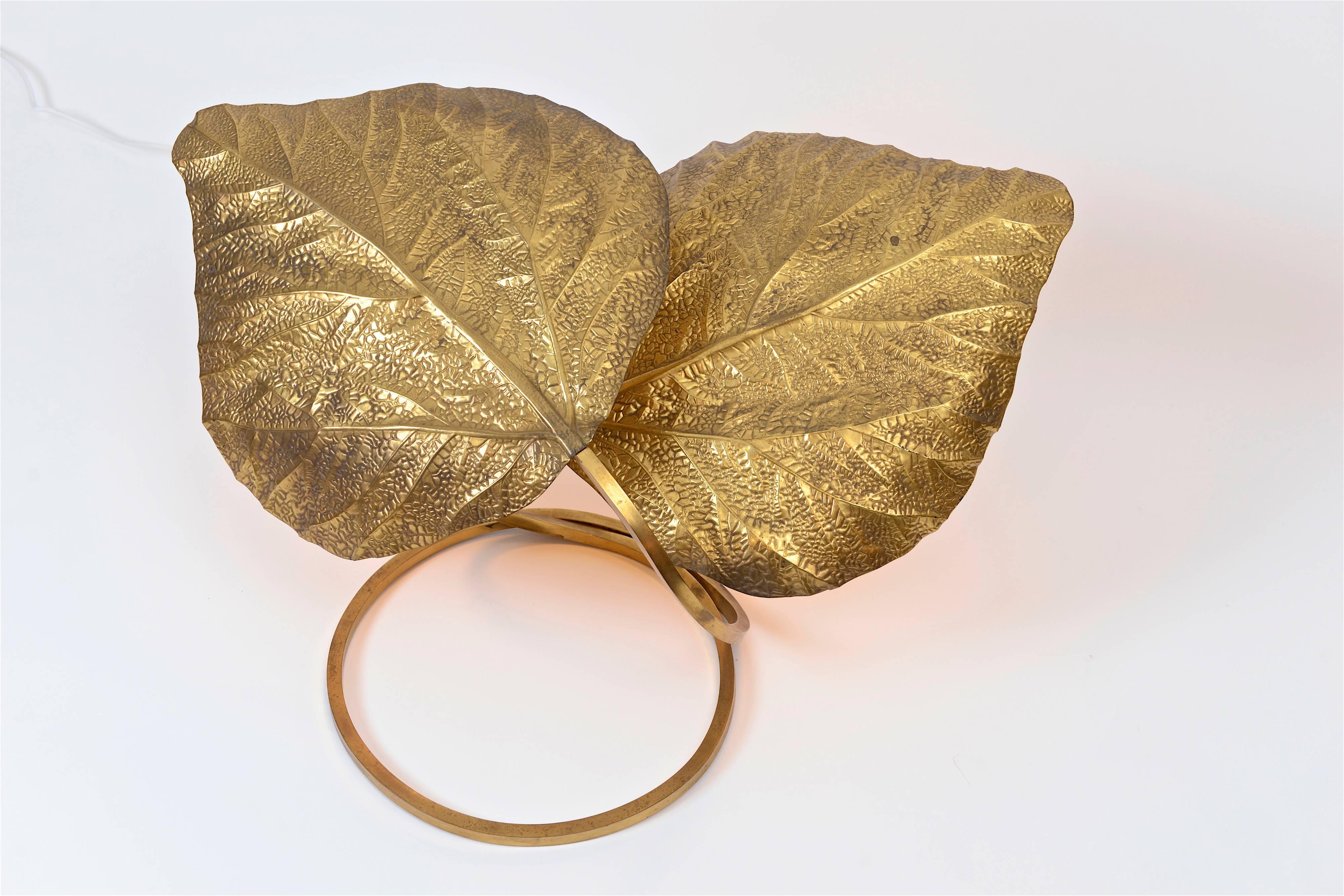 A superb example of a two-leaf 'Rhubarb' table light by Tommaso Barbi for Carlo Giorgi. Produced in Italy in the 1970s, the decorative hammered brass leaves each feature a single light fitting on the underside which beautifully reflect the gold