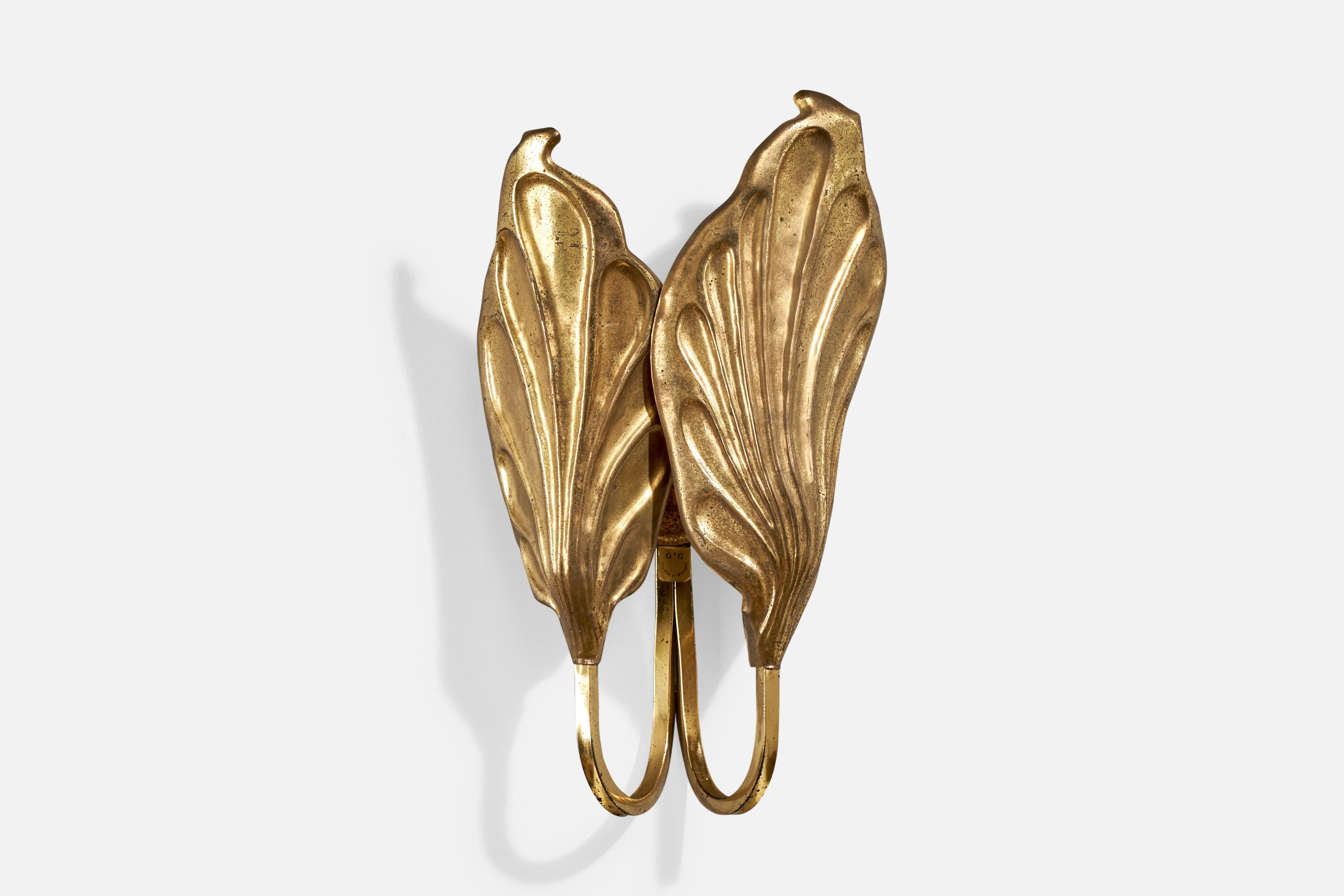 A brass wall light designed by Tommaso Barbi and produced G&G, Italy, c. 1970s

Overall Dimensions (Inches): 16” H x 8.5” W x 5.5” D

Back Plate Dimensions (Inches): 2.625” H x 2.625” W x .75” D

Bulb Specifications: E-14

Number of Sockets (per