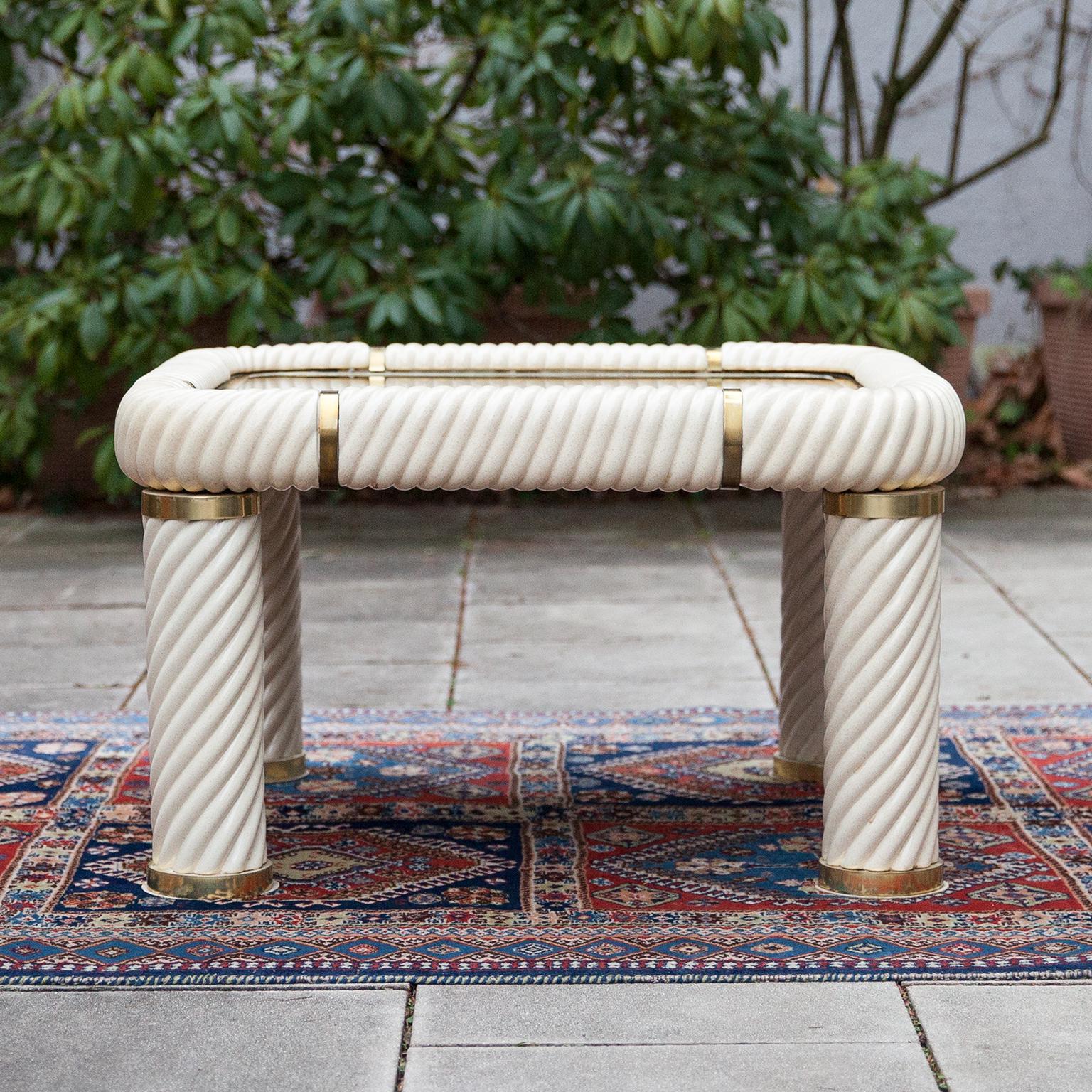 Elegant Hollywood Regency porcelain and mirrored glass squared coffee table. Designed by Tommaso Barbi in the 1970s. This remarkable piece features spiral-form ceramic porcelain column legs and a mirrored bronzed glass top with solid brass finishes