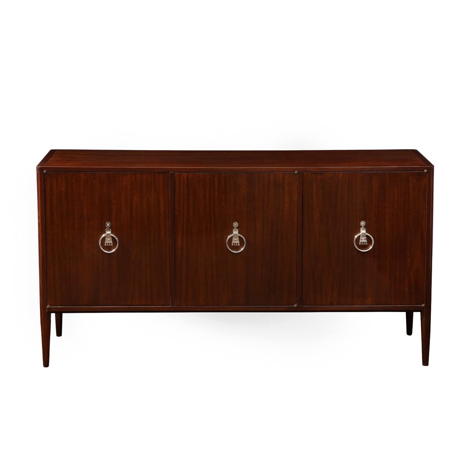 Beautifully crafted 3 door credenza in high gloss mahogany with exquisite etched nickel pulls by Tommi Parzinger for Parzinger Originals, American 1960s. This piece exudes refinement and elegance in a way only Parzinger could create.