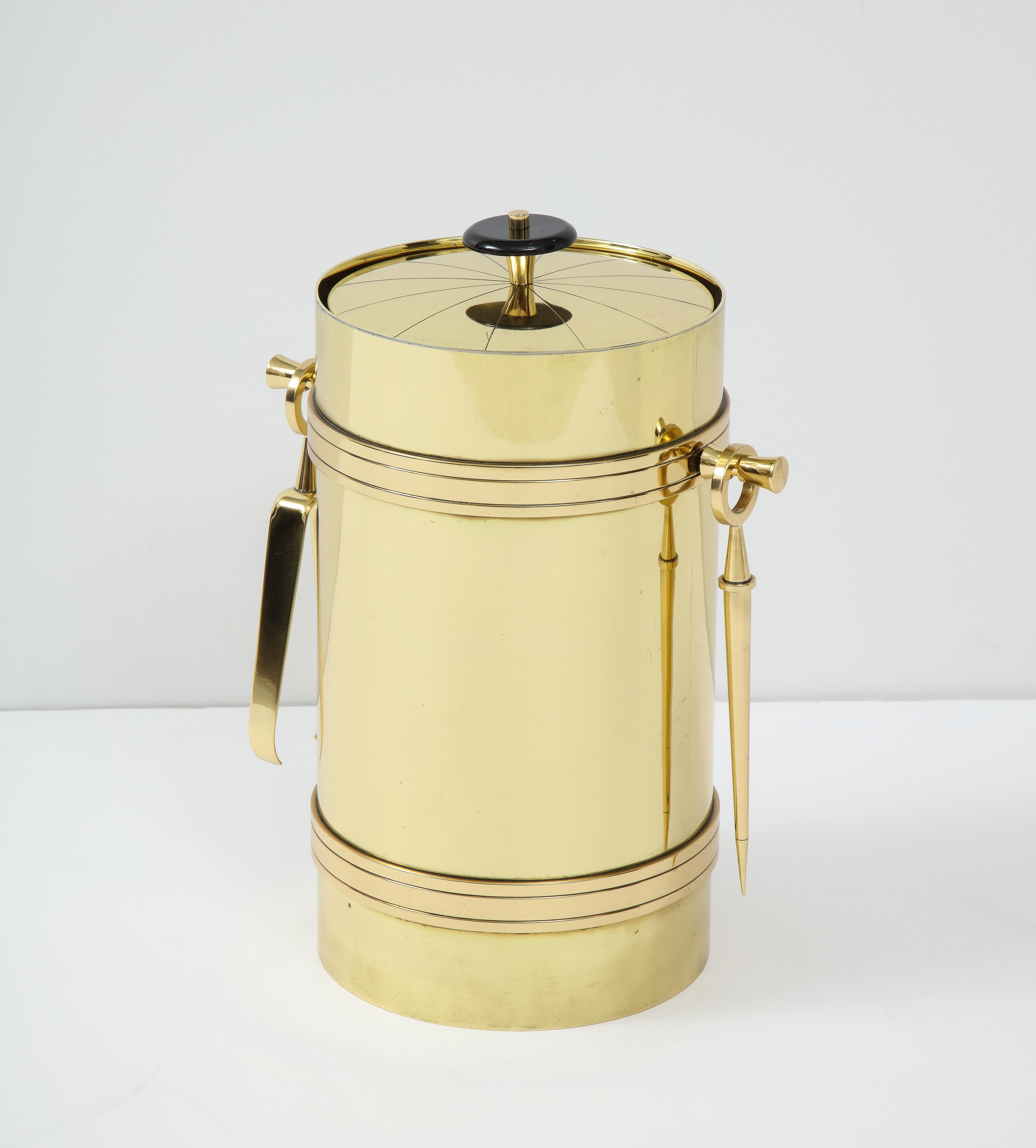 Classically tailored brass ice bucket with tongs and ice pick designed by Tommi Parzinger for Dorlyn Silversmiths.