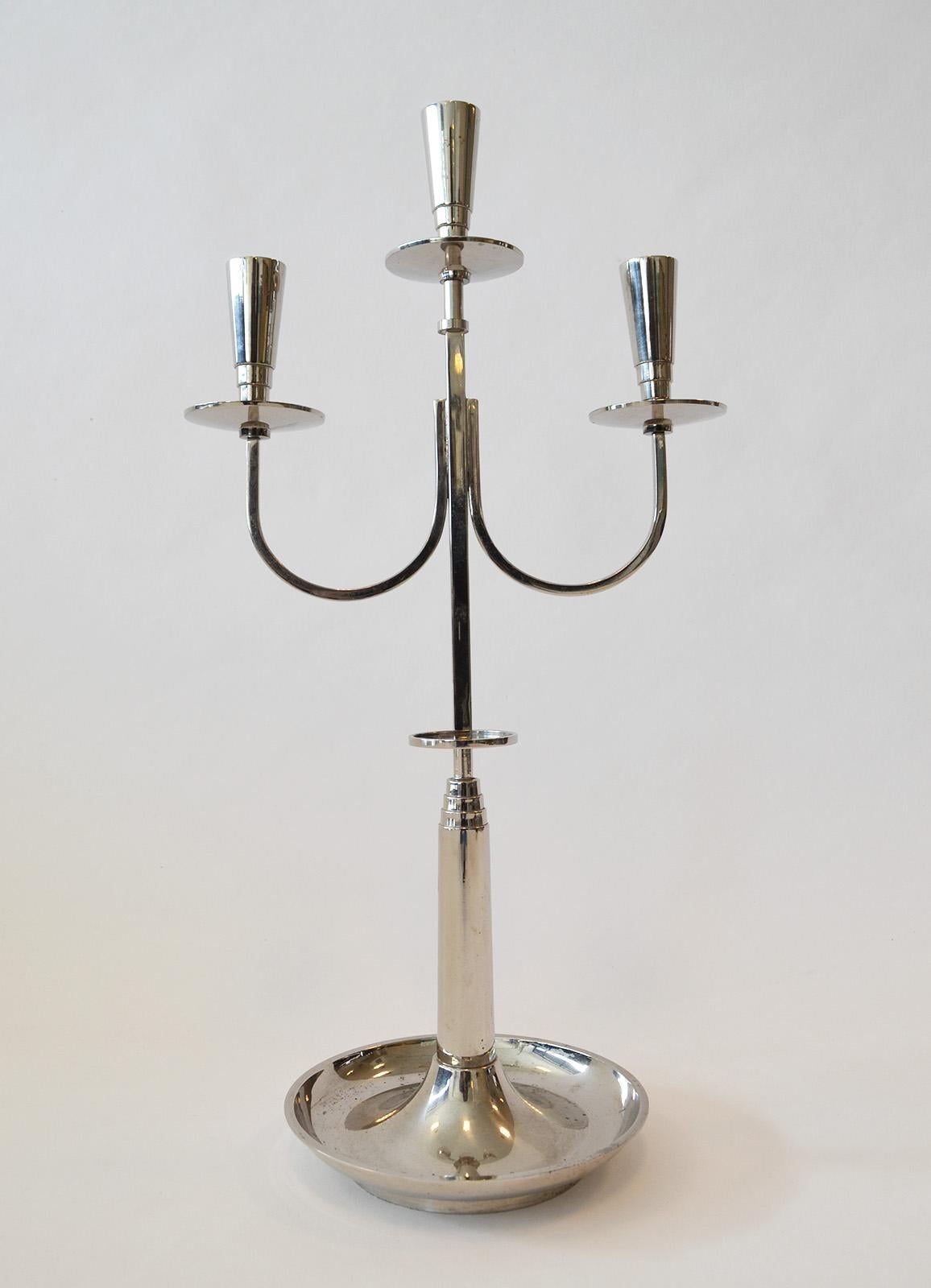 Tommi Parzinger Candlestick Candelabra
Trident form, art deco lines and geometry. Silver plate over brass. Unsigned. 
