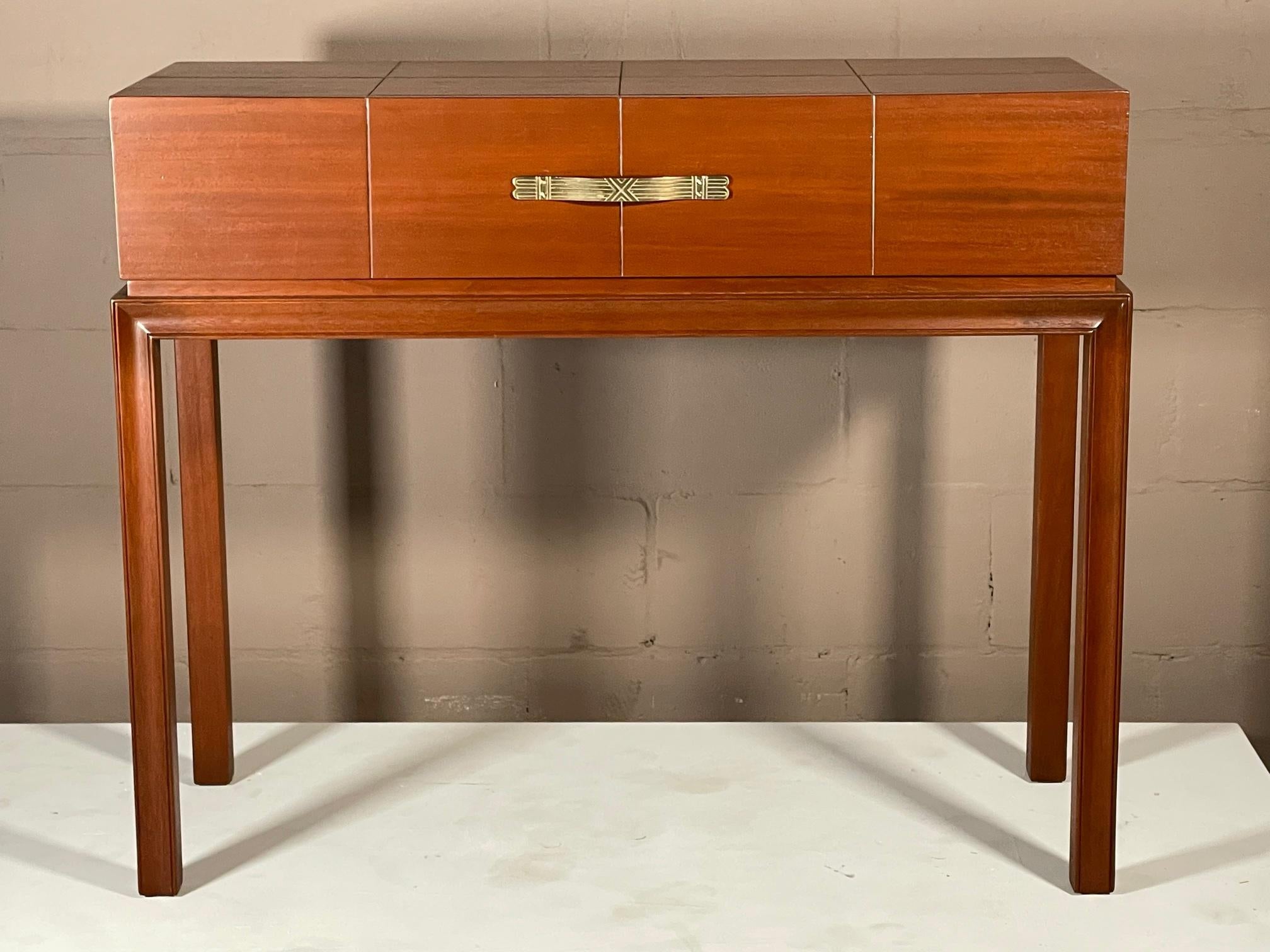 A classic console table by Tommi Parzinger for Charak Modern ca' 1940's. Single drawer with classic brass hardware.