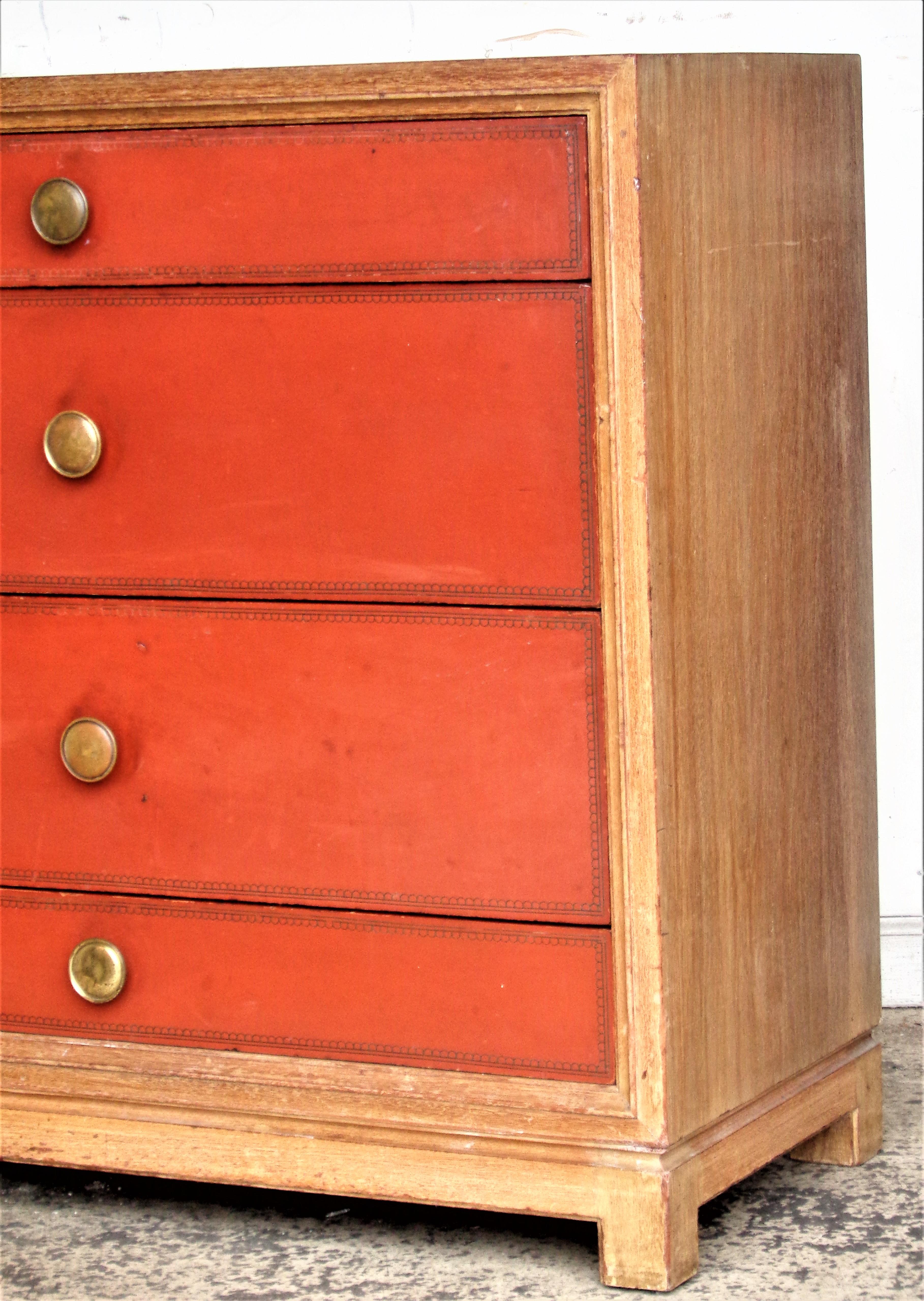 Tommi Parzinger for Charak Modern, Boston Ma. - four drawer chest / dresser in original bleached mahogany, tooled leather drawer fronts / brass hardware / manufacturers decal at interior side of top drawer. Circa 1950's. Look at all pictures and